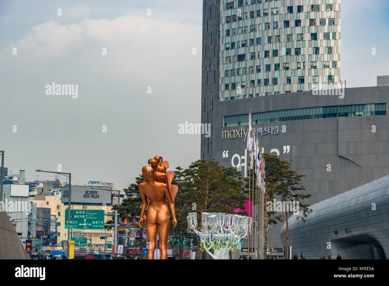 SEOUL, SOUTH KOREA - DECEMBER 31, 2016 - View of Dongdaemun Design Plaza in Seoul with a sculpture of a woman. Stock Photo