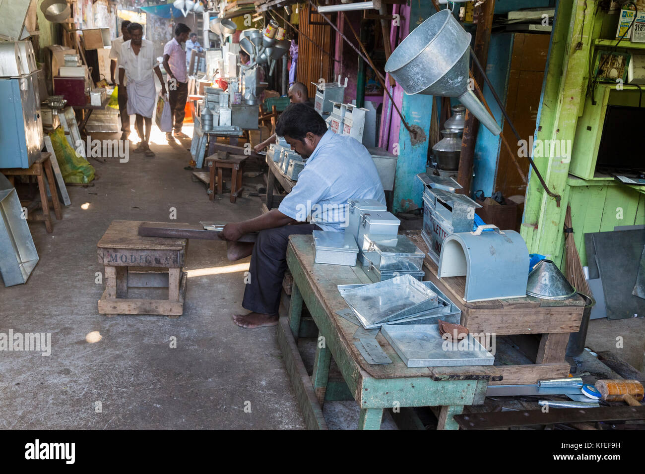 PONDICHERY, PUDUCHERY, INDIA - SEPTEMBER 09, 2017? Unidentified man makes metal mail boxes at the outdoor market place. Hand made in India Stock Photo