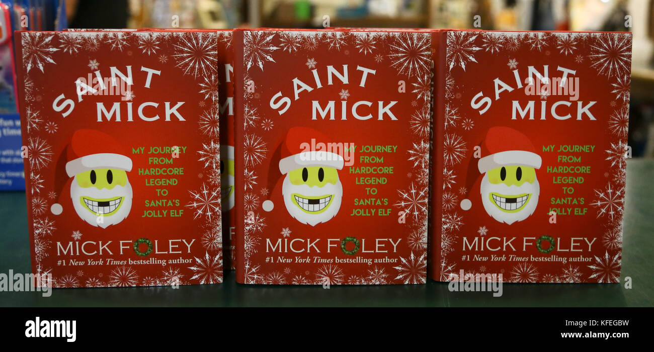 Copies of Mick Foley's book, 'Saint Mick: My Journey From Hardcore Legend to Santa's Jolly Elf' at Book Revue on October 19, 2017 in Huntington, NY. Stock Photo