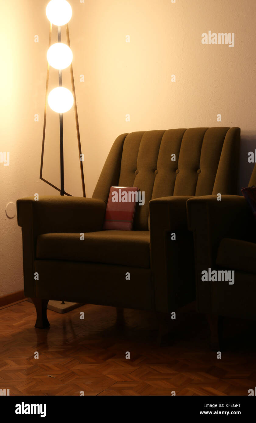 old armchair and vintage lamp in an old living room Stock Photo - Alamy