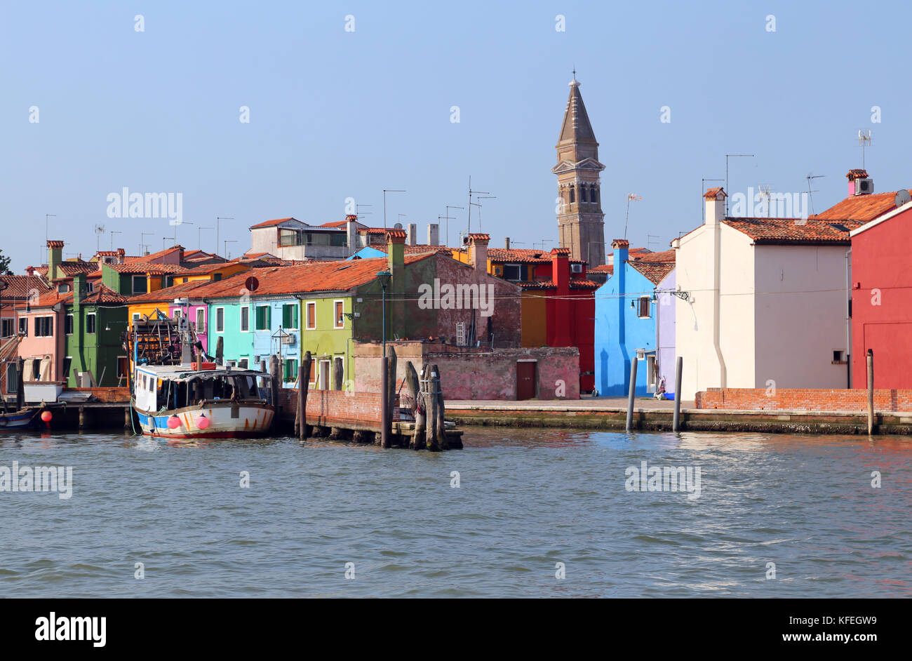 coloured houses in Burano island near Venice in Italy and the bell tower Stock Photo