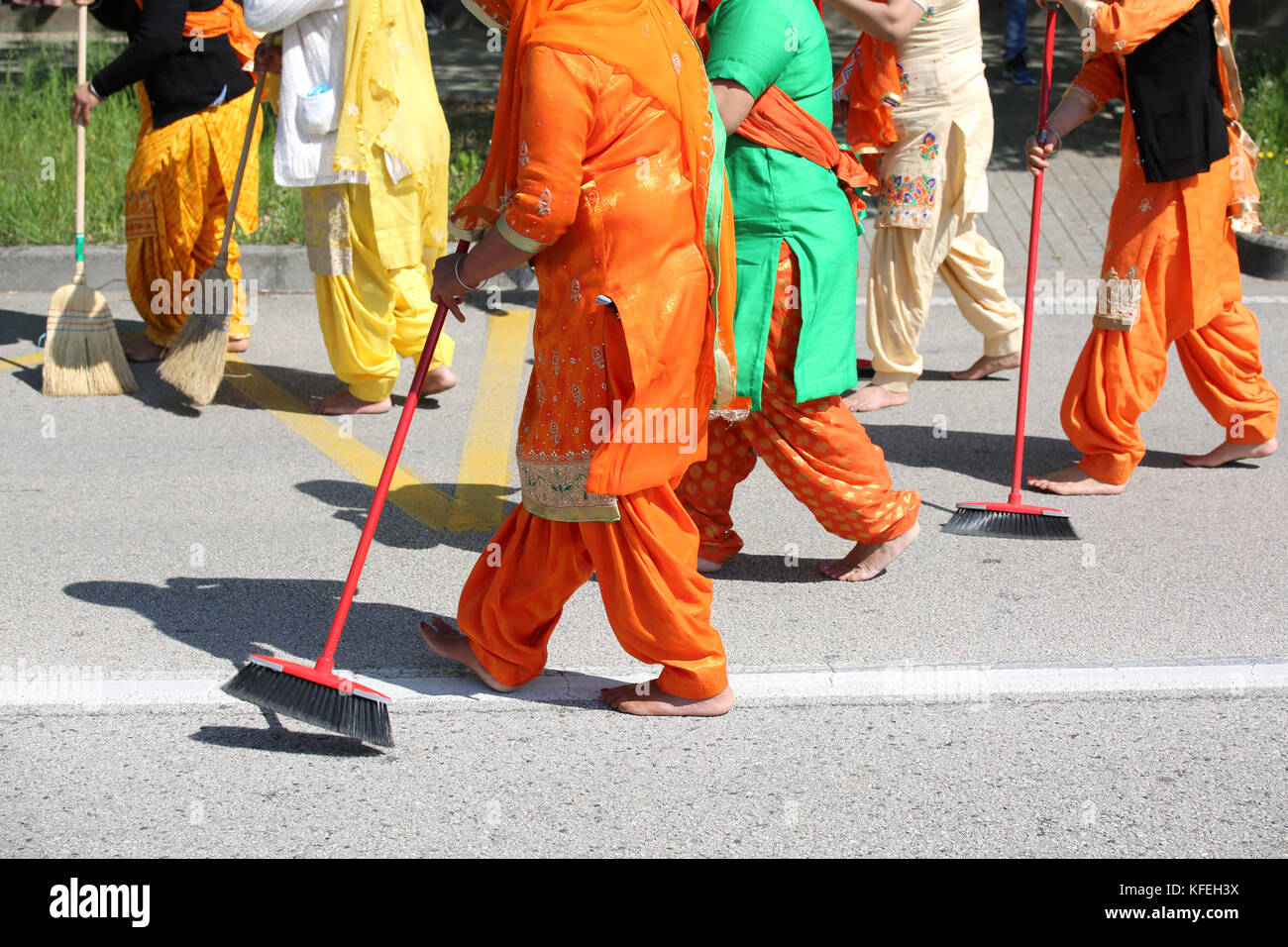Sikh religion event and the brave women with colorful clothes sweeping