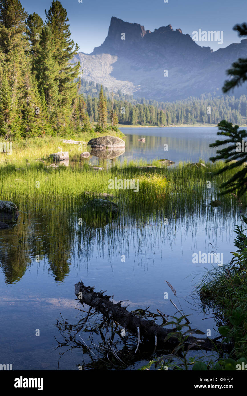 Fantastic sunny day is in mountain lake. Creative collage. Beauty world in the Ergaki national park, Russia Stock Photo
