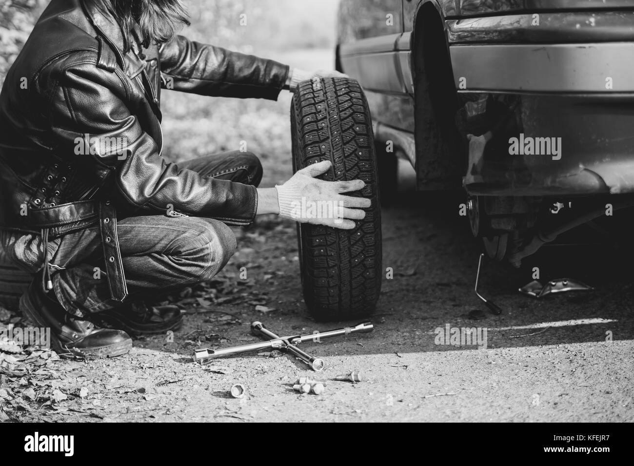 Change a flat car tire on road with Tire maintenance, damaged car tyre