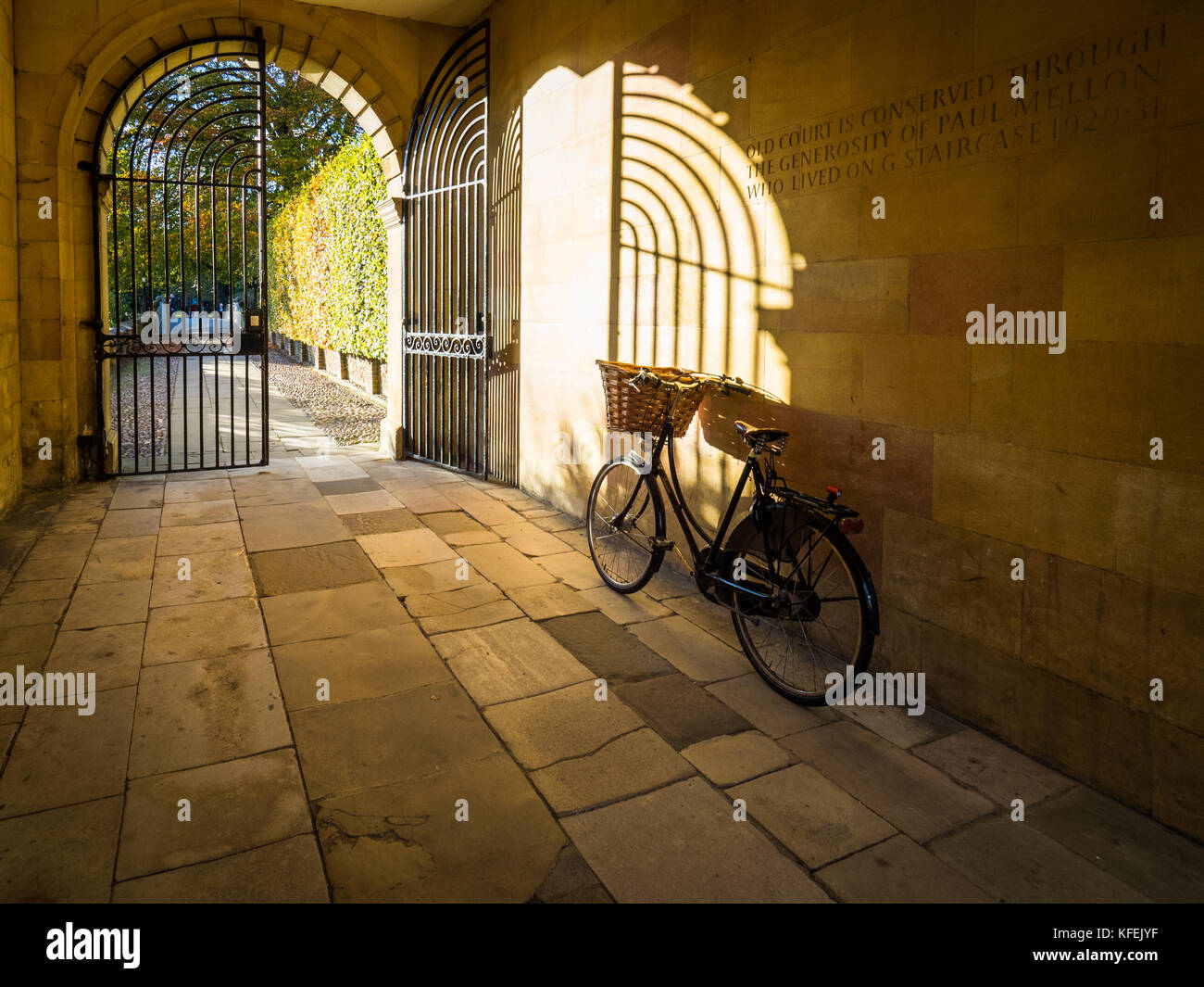 Cambridge Tourism - Student Bike parked in a picturesque gateway in Clare College, part of Cambridge University in central Cambridge UK Stock Photo
