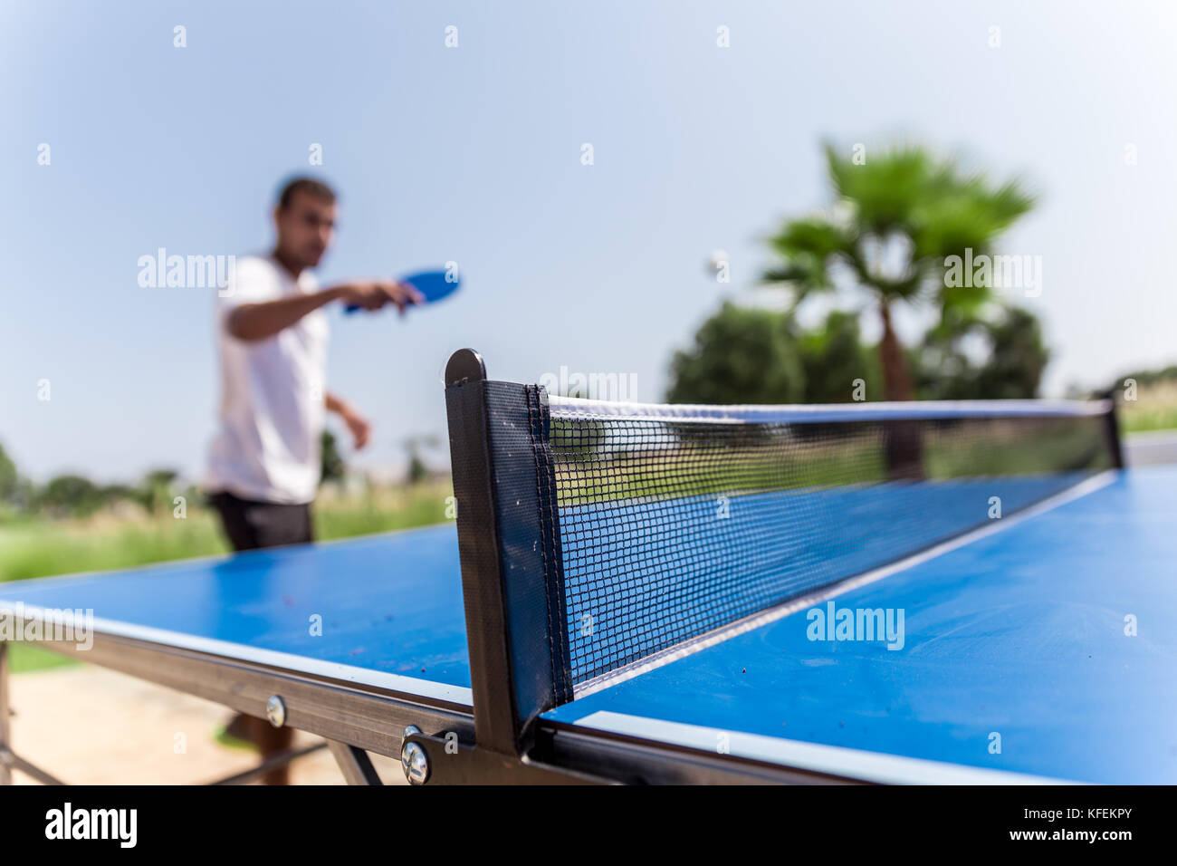 exterior ping pong game on a sunny day, Saidia, Morocco Stock Photo
