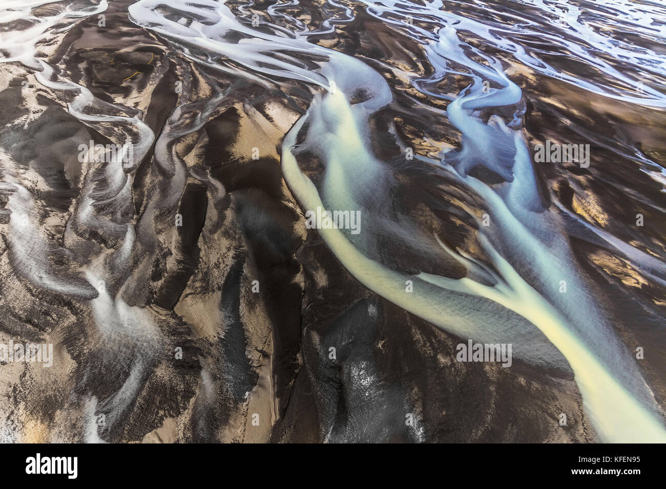 River Shapes in the Black Sand Stock Photo
