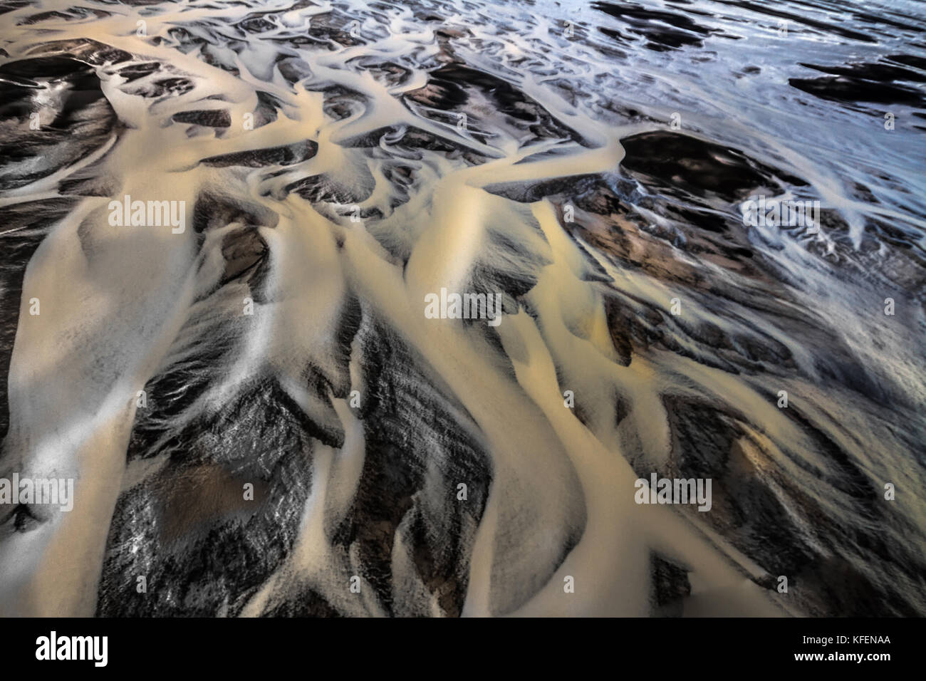 River Shapes in the Black Sand Stock Photo