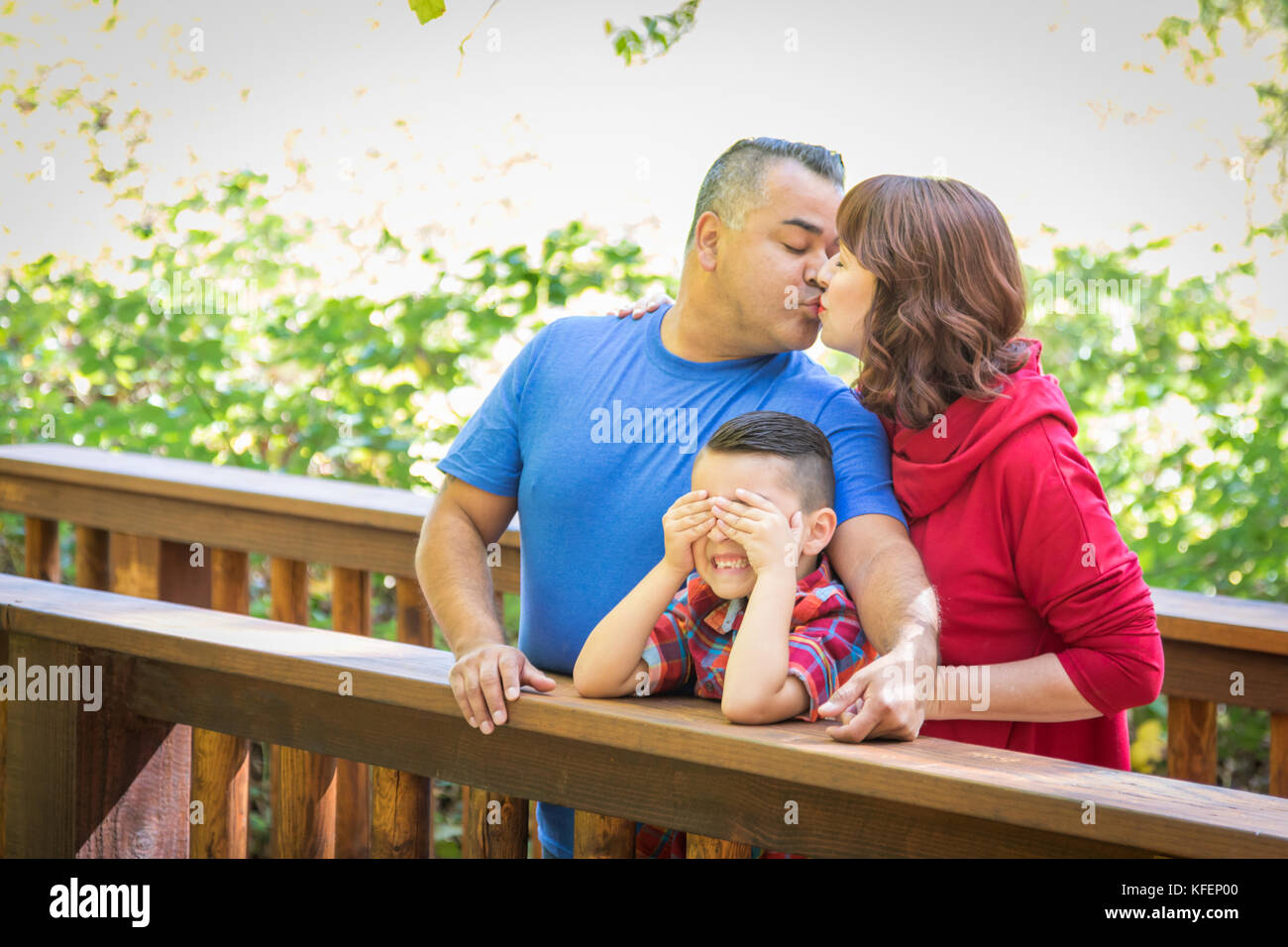 Mixed Race Caucasian and Hispanic Family At The Park. Stock Photo