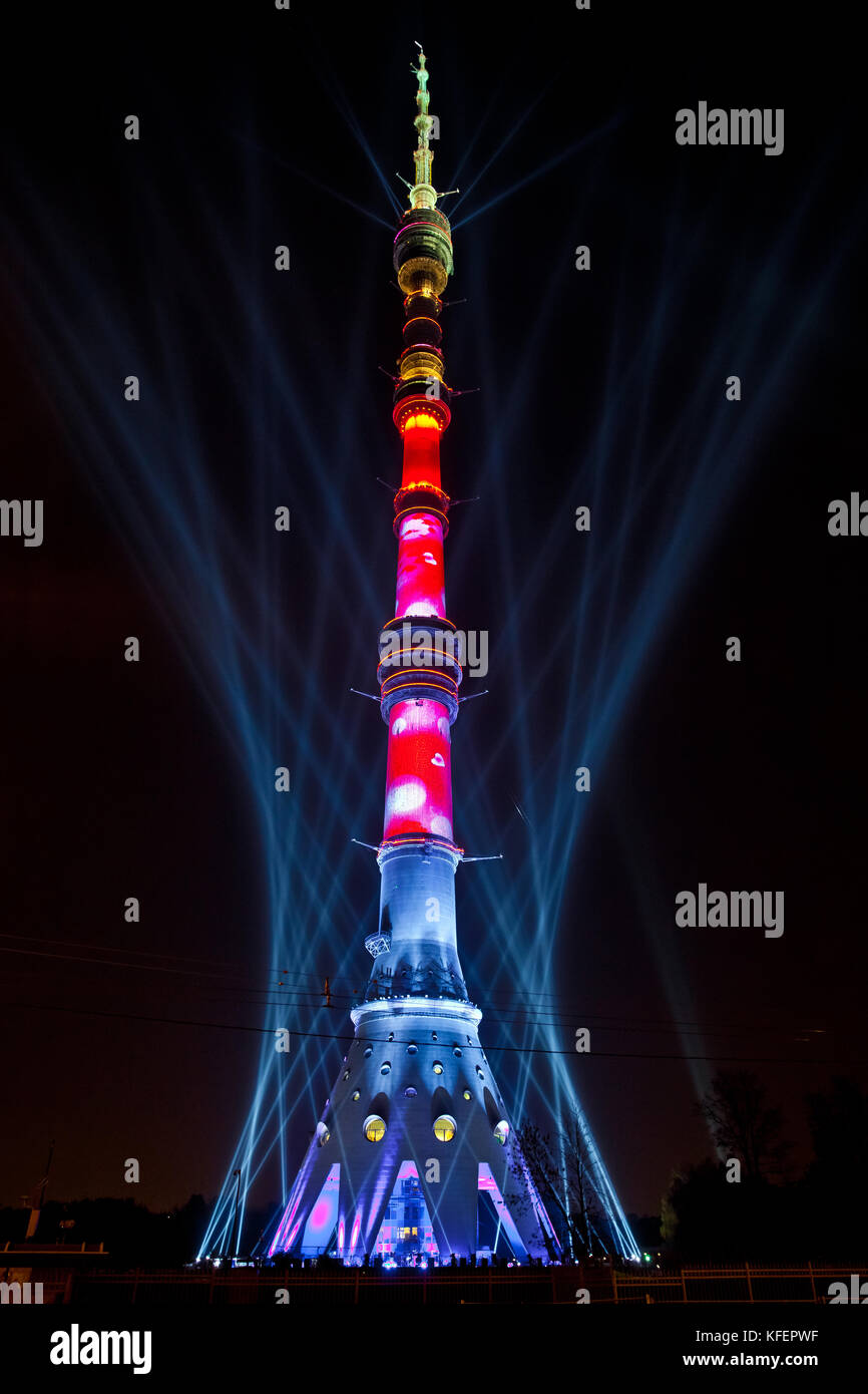 International Festival 'Circle of Light'. Laser video mapping show on Ostankino TV tower in Moscow, Russia. 3D projection mapping on building and firework show Stock Photo