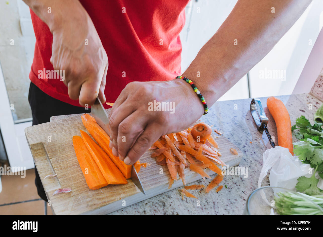 Man Cooking Cut Carrot Julienne Style In The Kitchen Man Cooking Cut Carrot Julienne Style In The Kitchen