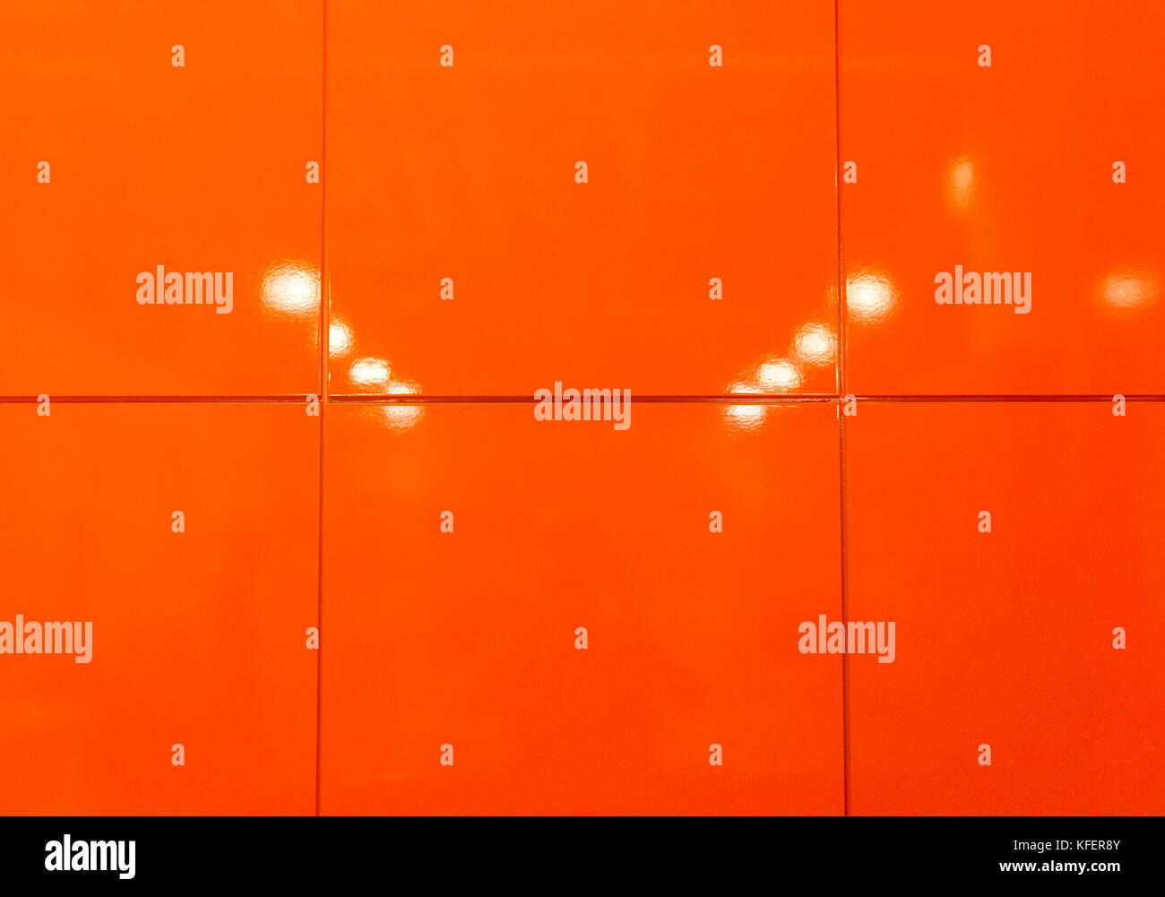 orange glossy noble urban mirroring flagging, tile texture with lights .backgrounds and texture. background textures surface. background wallpaper Stock Photo