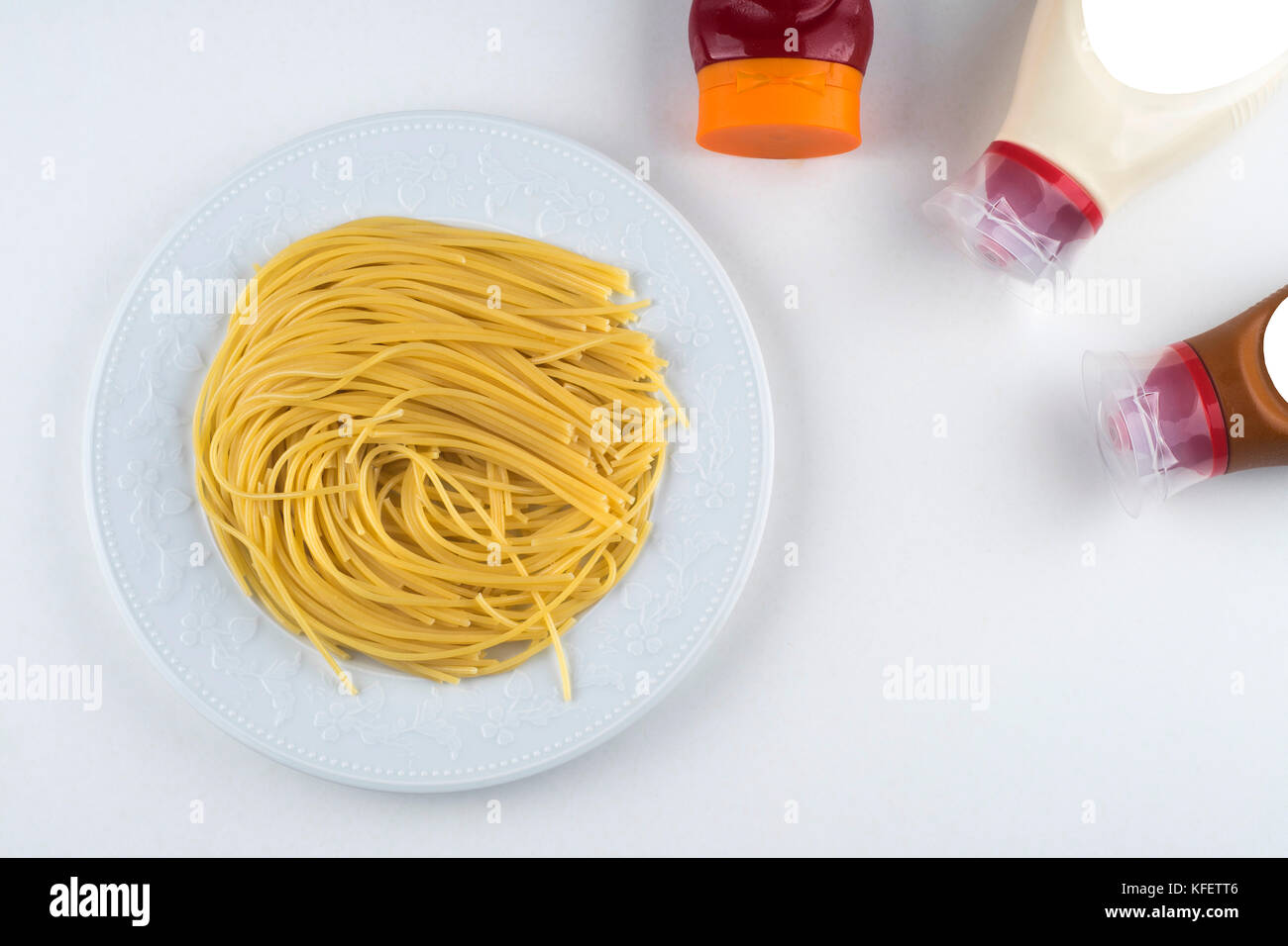 spaghetti with ketchup mayonnaise on white background Stock Photo Alamy