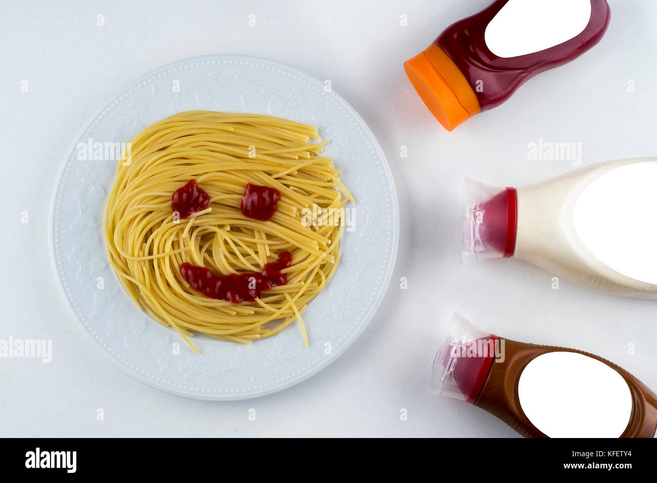 spaghetti with ketchup mayonnaise on white background Stock Photo Alamy