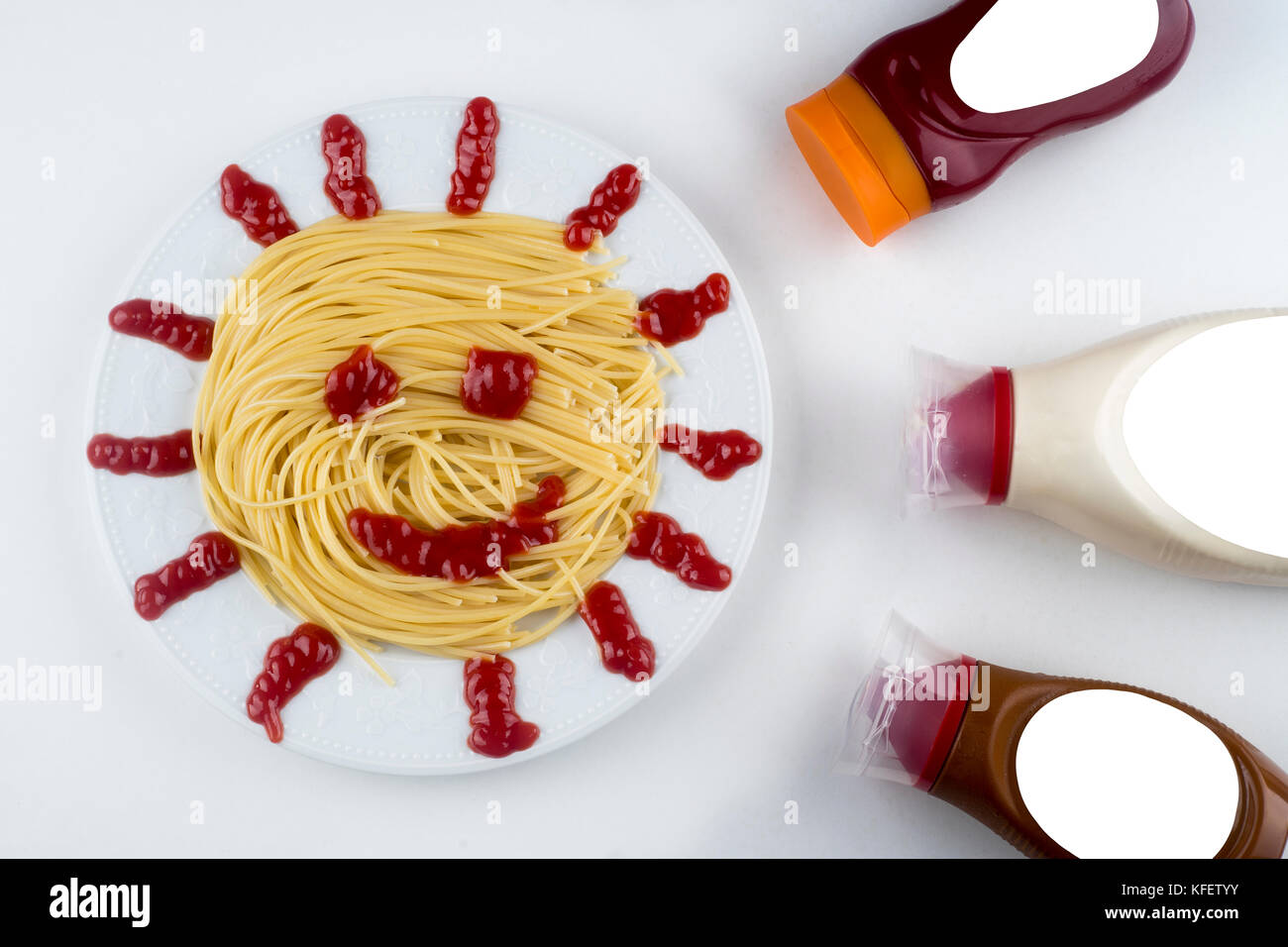 spaghetti with ketchup mayonnaise on white background Stock Photo Alamy