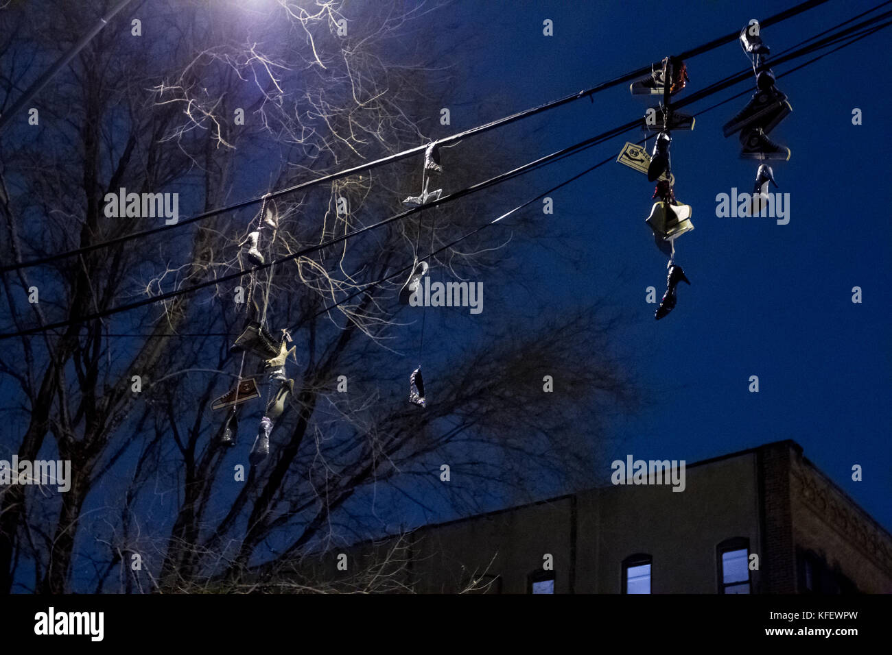 shoes hanging on telephone cables Stock Photo