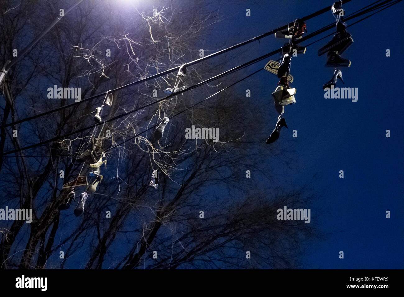 shoes hanging on telephone cables Stock Photo