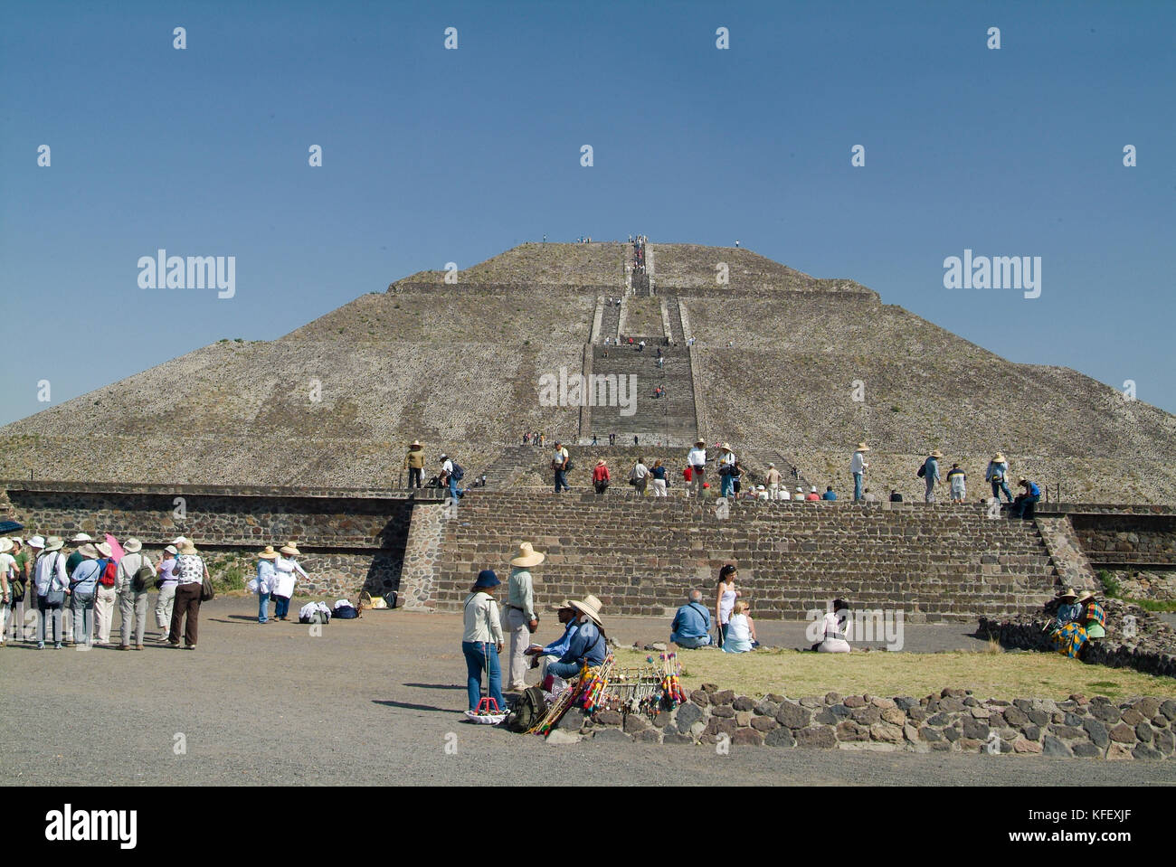 Crowd of tourists climbing the top of Pyramid of the Sun and Pyramid of