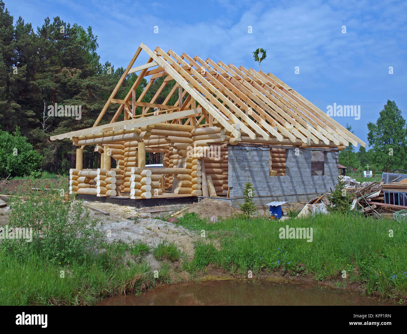 Wooden House From Round Logs Under Construction Stock Photo