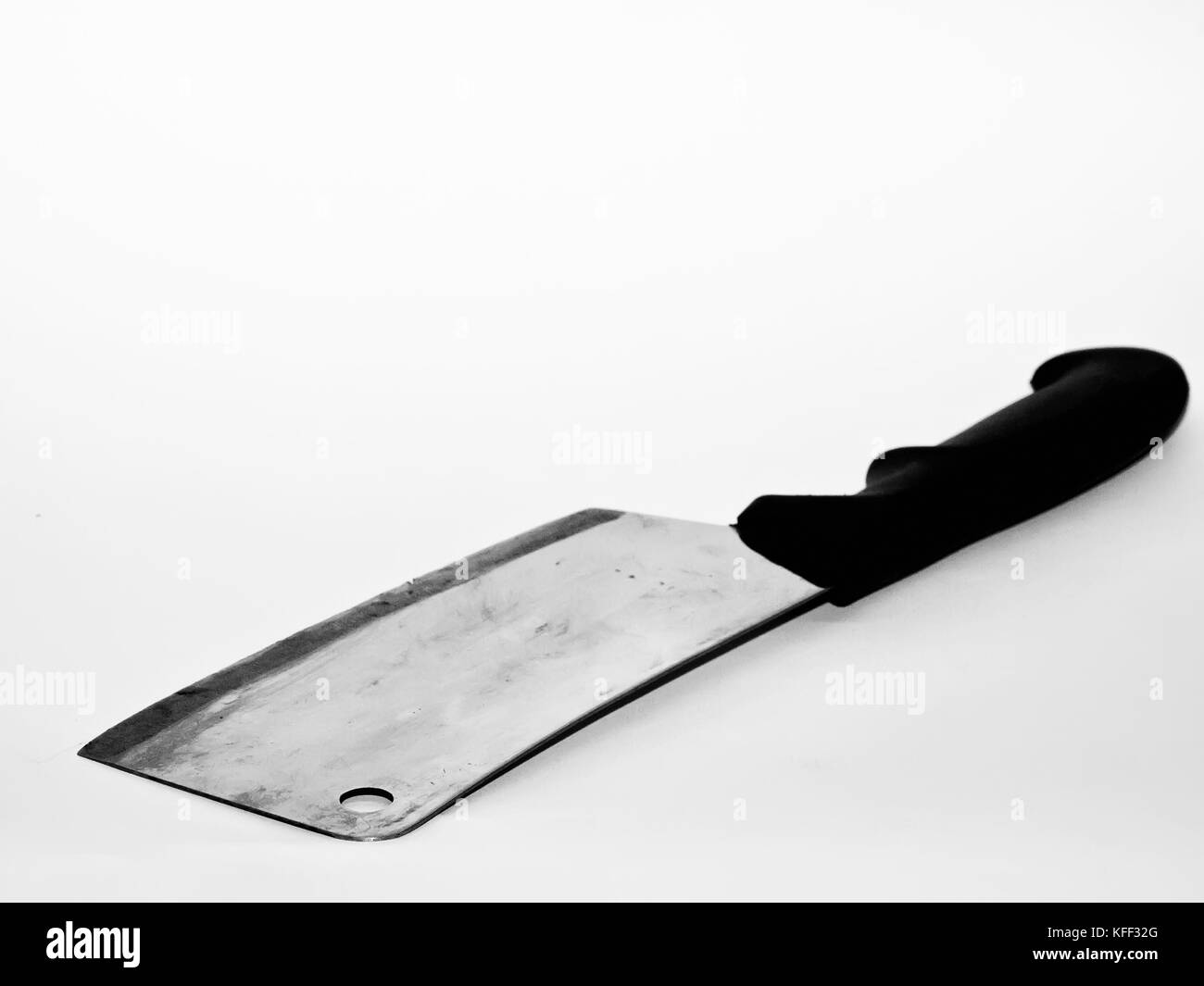 Cleaving knife over white backdrop Stock Photo