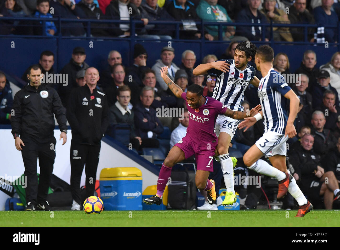 Manchester City's Raheem Sterling (left) and West Bromwich Albion's Ahmed Hegazy battle for the ball during the Premier League match at The Hawthorns, West Bromwich. Stock Photo