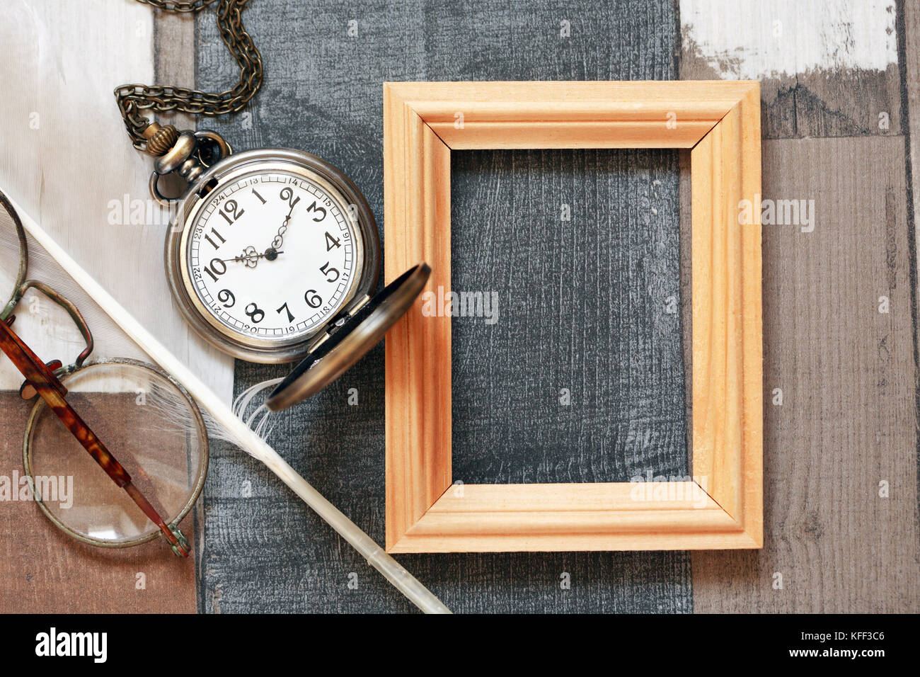 Vintage still life with old glasses and wooden frame Stock Photo