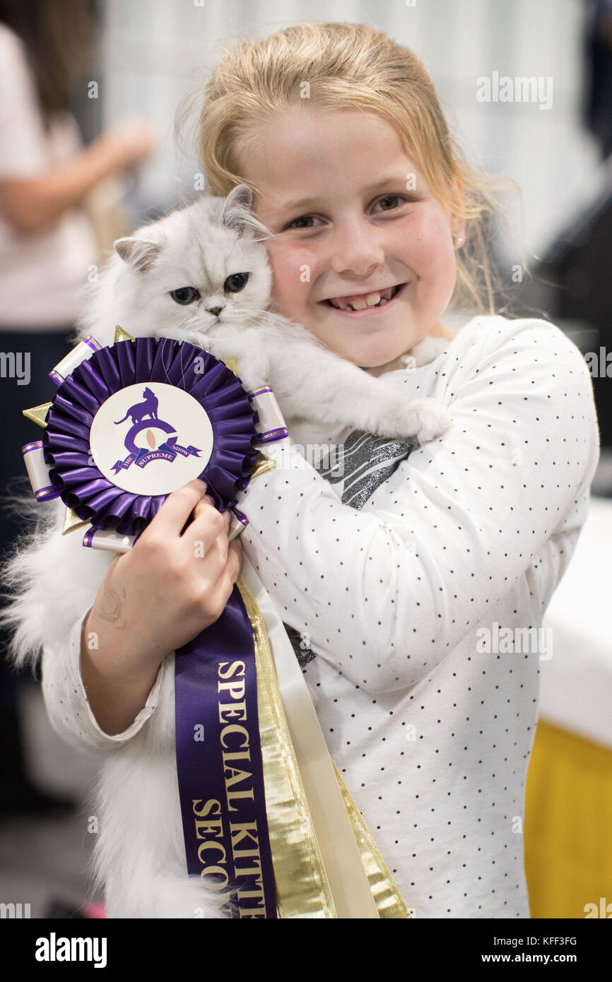Nicole Gibson, 8, with her prize winning Emporiums Starlight for the fun kitten class competition at the Supreme Cat Show in Birmingham. Stock Photo