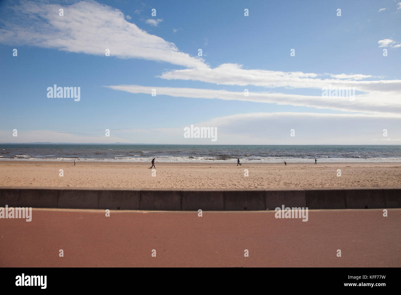 People walking on the beach of Portobello in Edinburgh, the capital