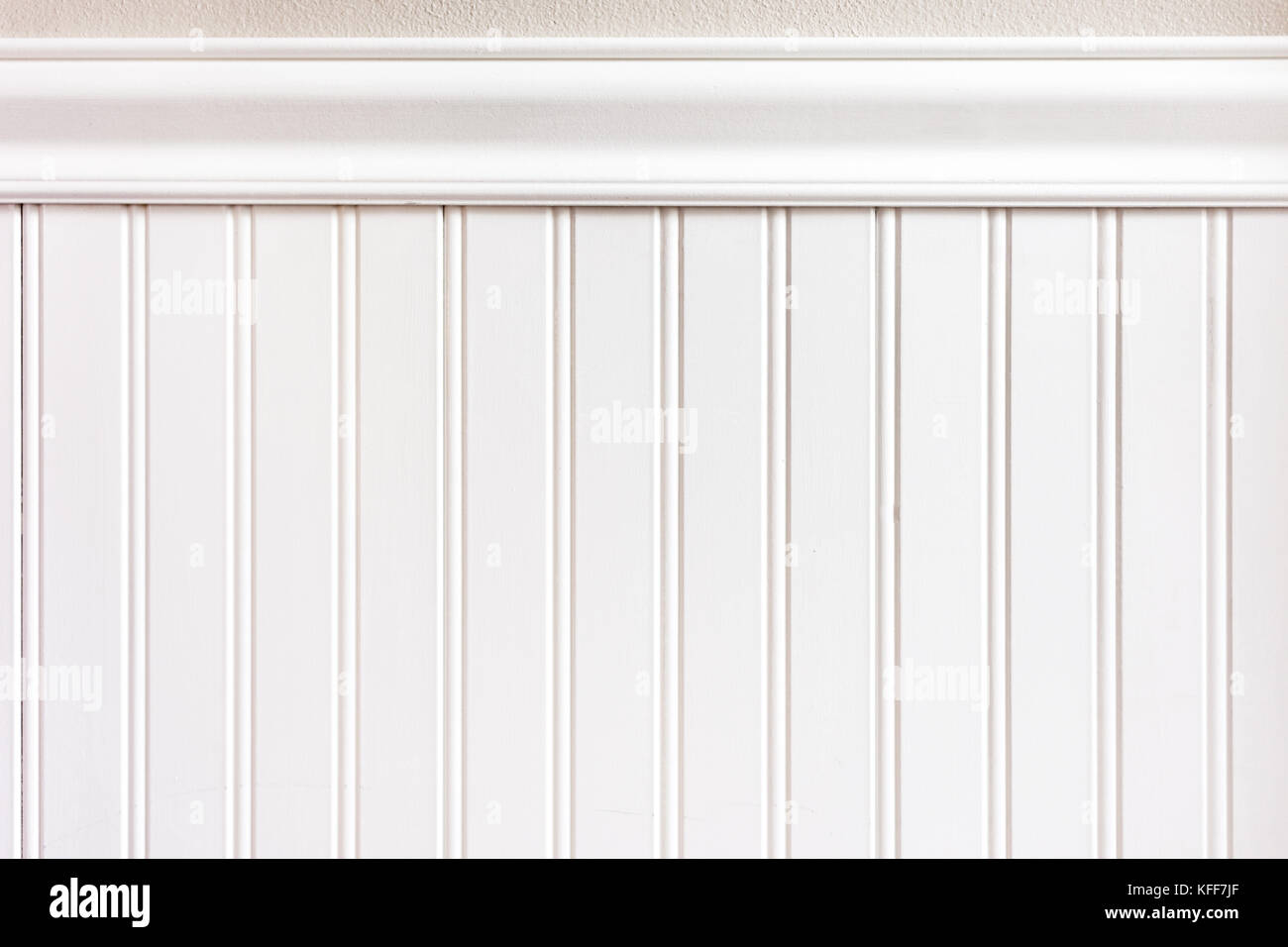 White bead board or wainscot paneling with chair guard trim board Stock