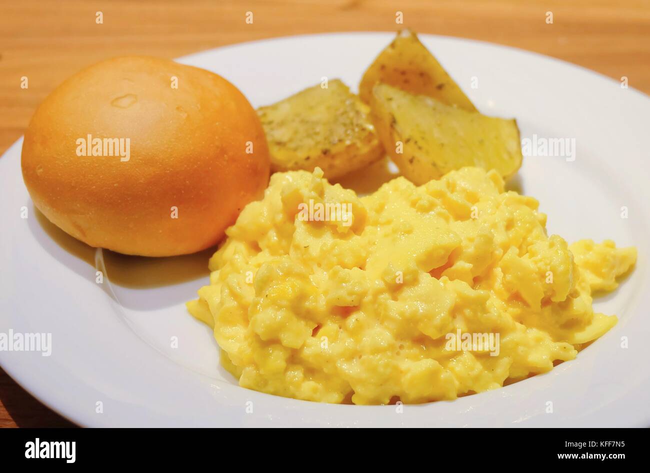Cuisine and Food, Plate of Delicious Scrambled Eggs with Round Bread ...