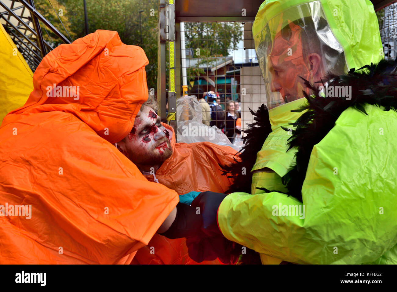 Bristol, UK. 28th Oct, 2017. .  The undead zombies with representatives from cycling accidents, to newly wed brides and just the dead walk and shuffle through central Bristol in spectacular costumes starting at College Green, past Castle Park to the Bear Pit in preparation for Halloween. At the end of the walk Avon Fire and Rescue Service’s mass decontamination units are set-up in the Bear Pit using the zombies as practice for mass decontamination.  Fun was had along the way with dancing and partying at the end by the many and varied participants. Credit: Charles Stirling/Alamy Live News Stock Photo