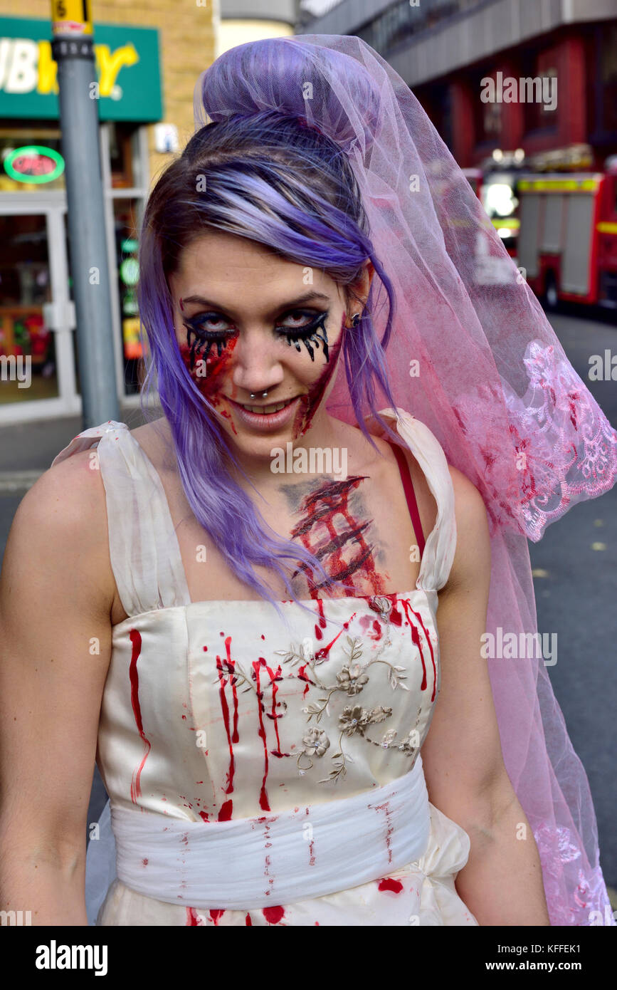 Bristol, UK. 28th Oct, 2017. The undead zombies with representatives from cycling accidents, to newly wed brides and just the dead walk and shuffle through central Bristol in spectacular costumes starting at College Green, past Castle Park to the Bear Pit in preparation for Halloween. At the end of the walk Avon Fire and Rescue Service’s mass decontamination units are set-up in the Bear Pit using the zombies as practice for mass decontamination.  Fun was had along the way with dancing and partying at the end by the many and varied participants. Credit: Charles Stirling/Alamy Live News Stock Photo