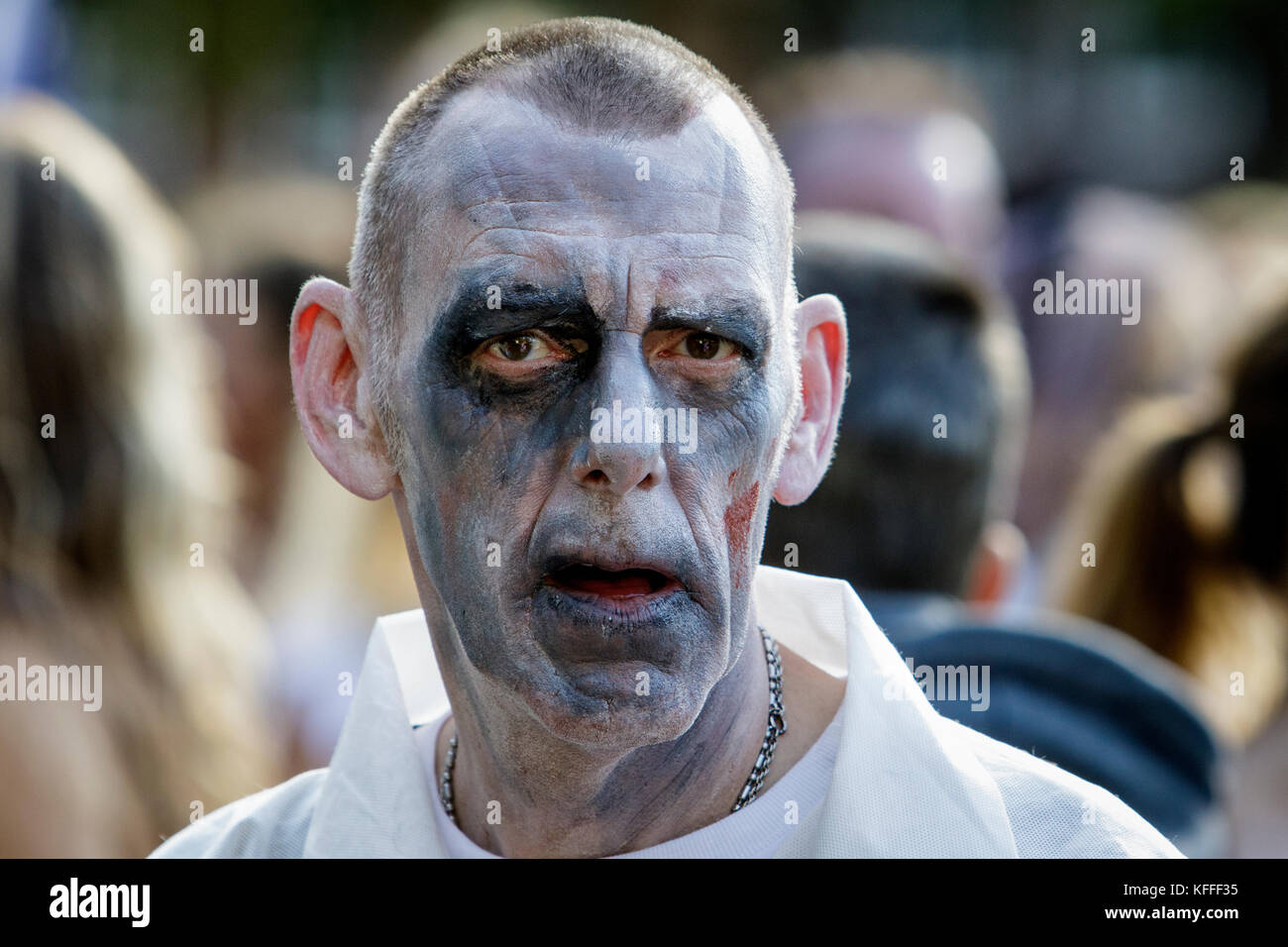 Bristol, UK. 28th Oct, 2017. A man dressed as zombies is pictured as he participate in a zombie walk through the city centre. Stock Photo