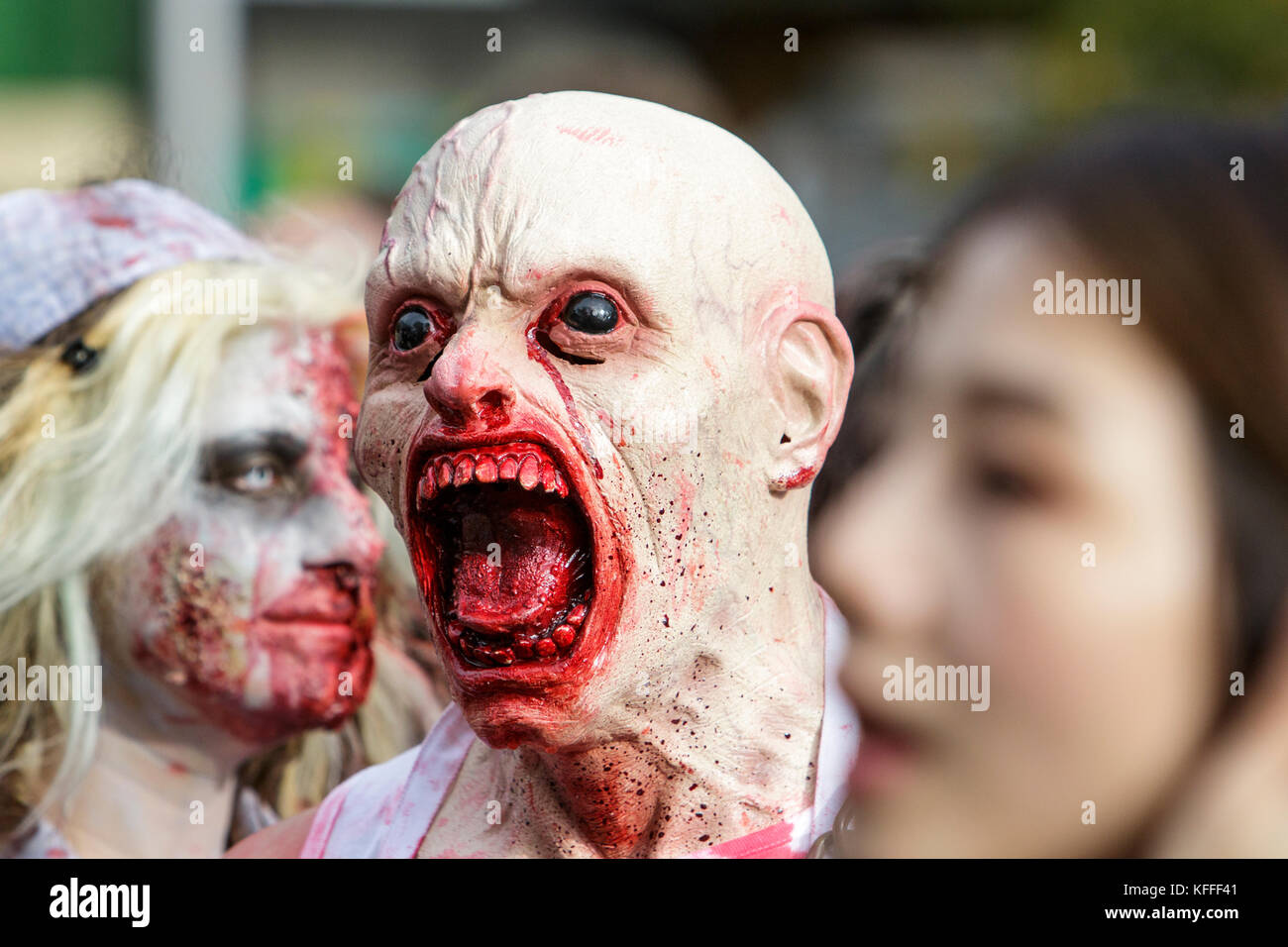 Bristol, UK. 28th Oct, 2017. People dressed as zombies are pictured as they participate in a zombie walk through the city centre. Stock Photo
