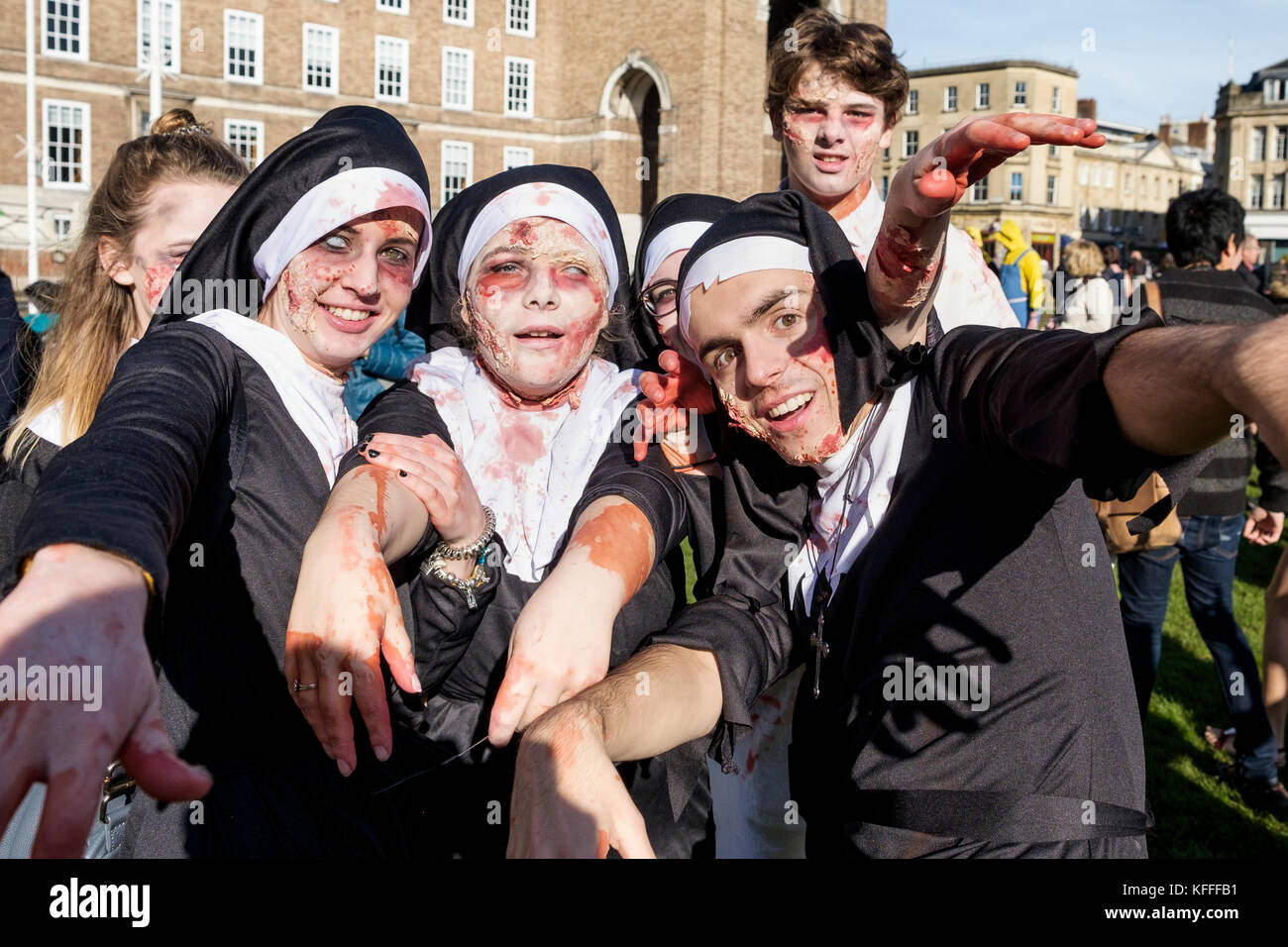 Bristol, UK. 28th Oct, 2017. People dressed as zombies are pictured as they participate in a zombie walk through the city centre. Stock Photo