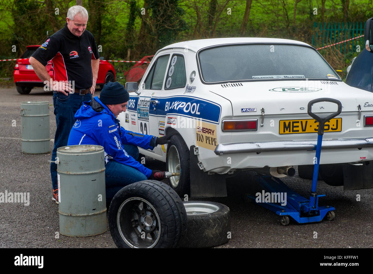 Bantry, Ireland. Saturday 28th Oct, 2017.  A rally car competing in tomorrow's West Cork Fastnet Rally has one of its wheels changed during scrutineering.  The rally starts early torrow morning from The West Lodge Hotel in Bantry and takes in the local countryside before finishing tomorrow afternoon. Credit: Andy Gibson/Alamy Live News. Stock Photo