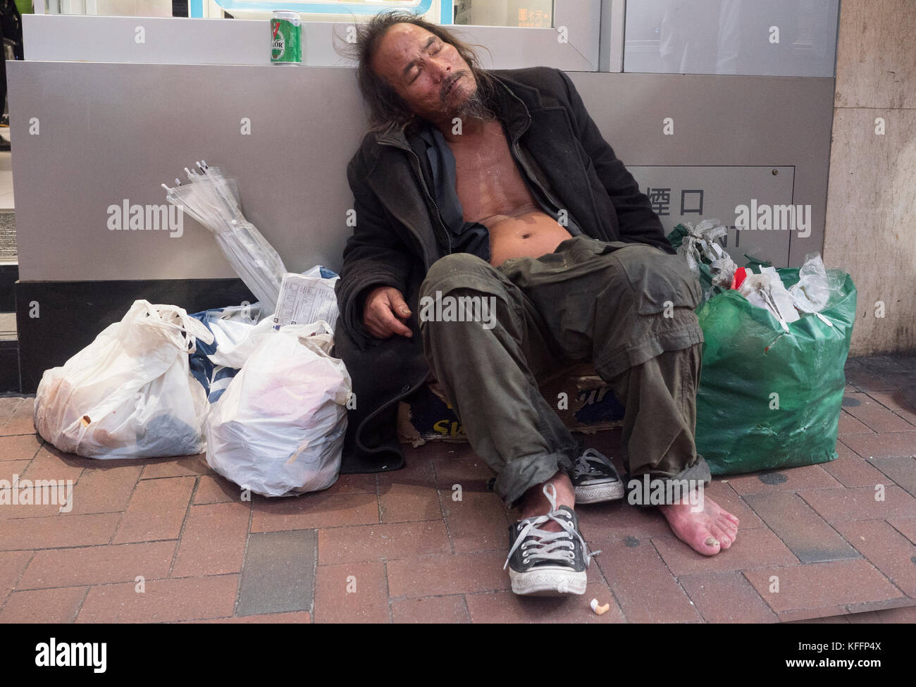 Homeless man on the streets of Hong Kong, China, Asia Stock Photo
