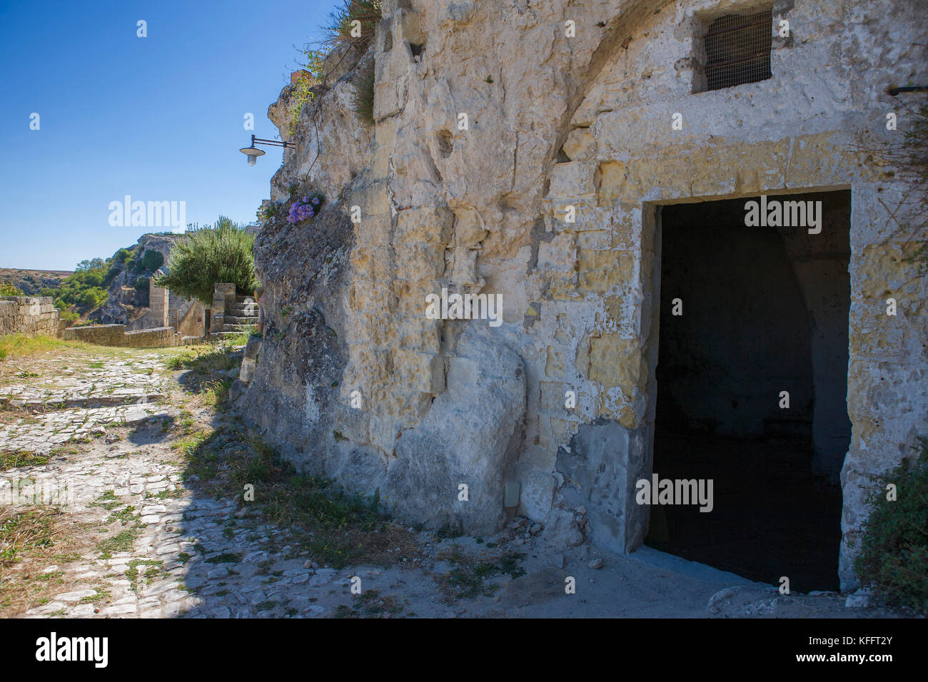 The entrance to an abandoned troglodytic dwelling (casa grotta) in the Sasso Caveoso, Matera, Basilicata, Italy Stock Photo