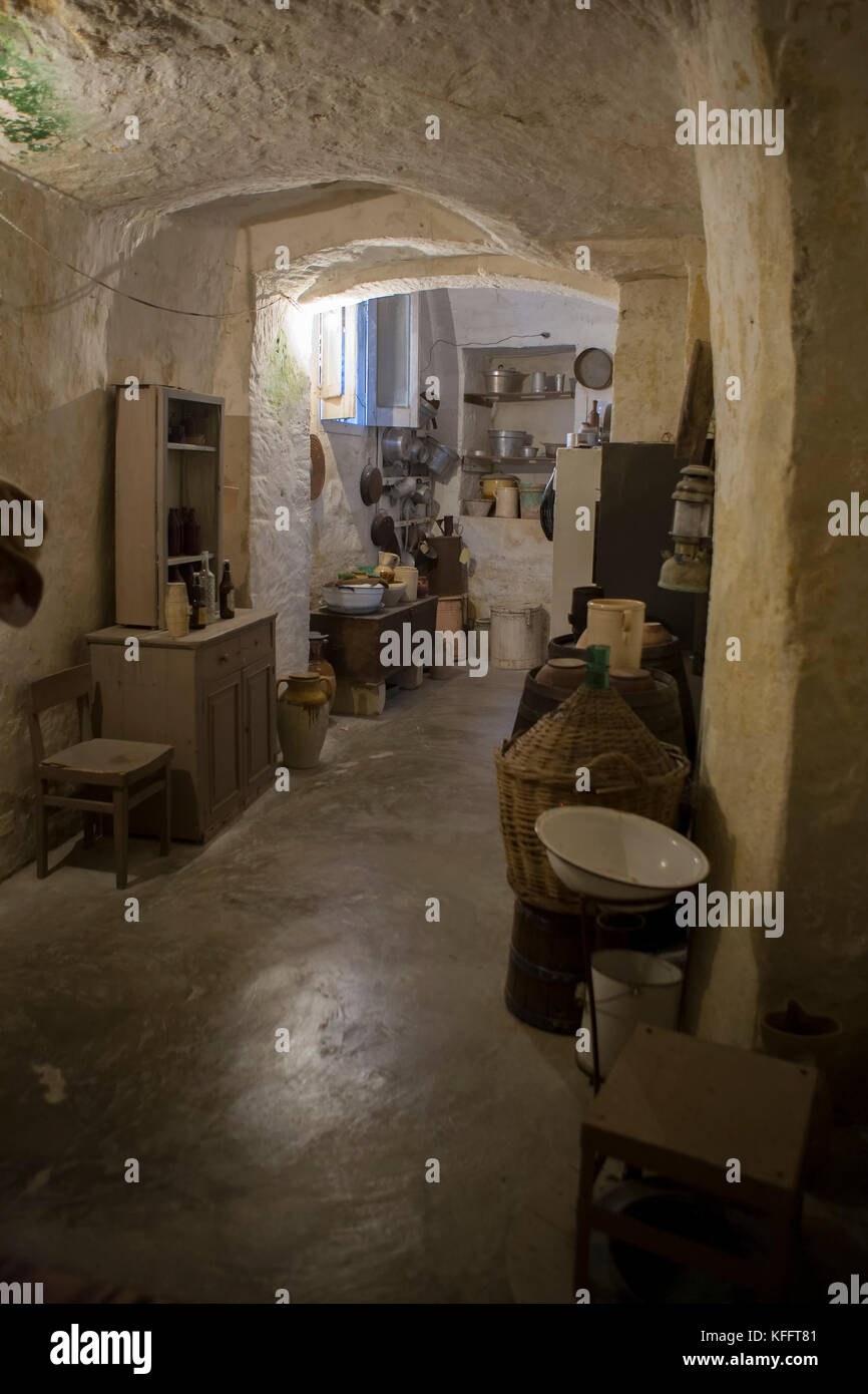 Inside the kitchen of a cave dwelling (the Casa grotta del Casalnuovo) restored as a living museum in the Sassi Caveoso, Matera, Basilicata Stock Photo
