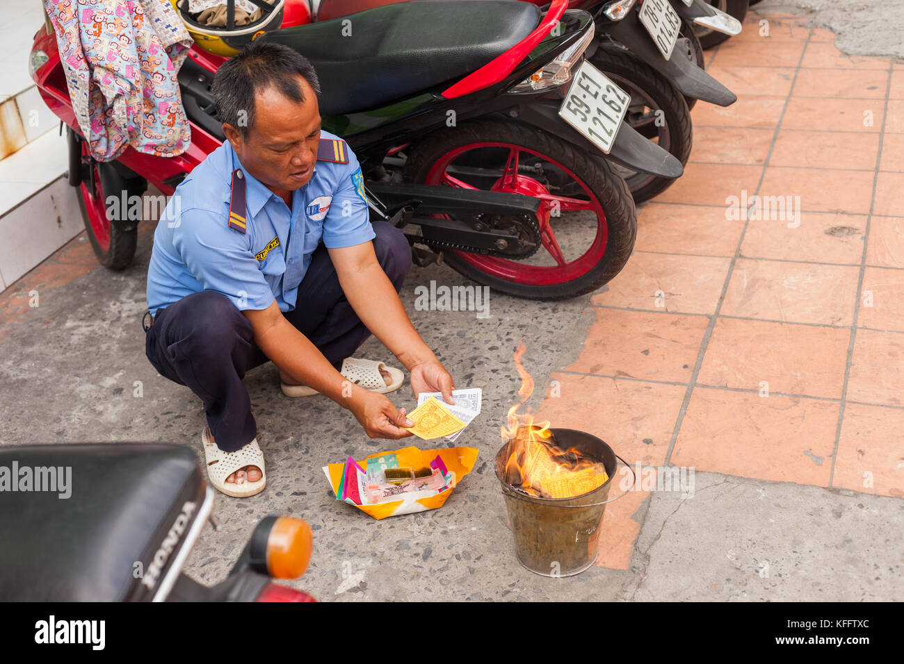 Burning money (Ghost/Votive money, Joss paper) in Vietnam Stock Photo