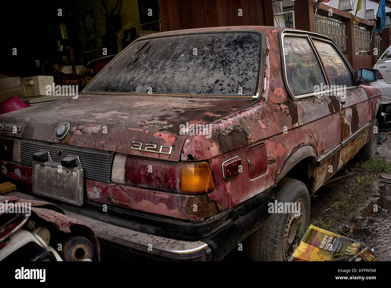 Rust. Abandoned and rusting BMW car. Thailand Southeast Asia Stock Photo
