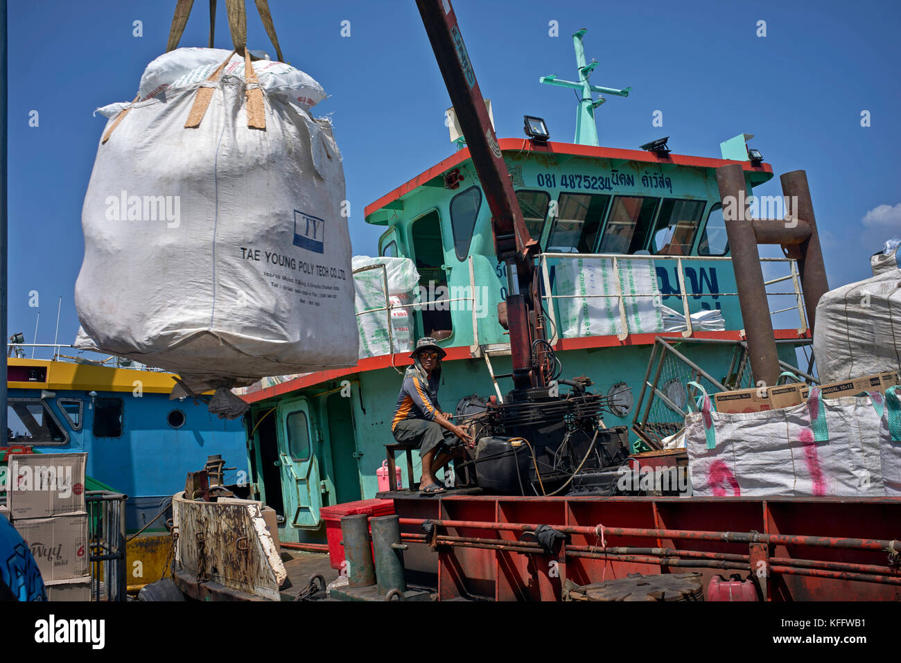 Crane boat loading and unloading area. Pattaya commercial shipping port ...