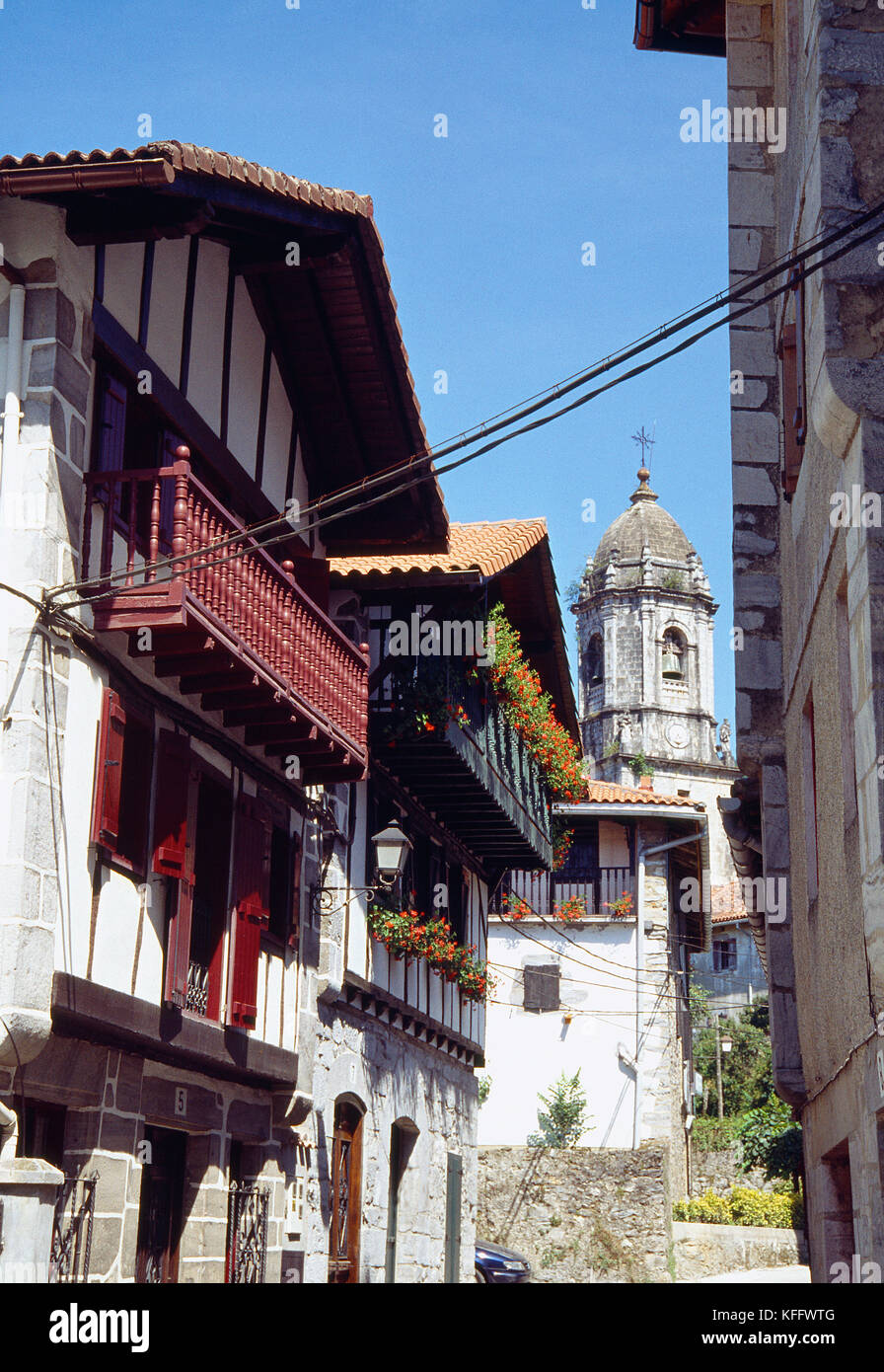 Facades of houses and tower of San Martin de Tours church. Lesaca