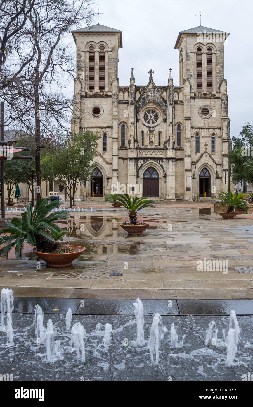 Vertical shot of San Fernando Cathedral, San Antonio, Texas with small water fountains in the foreground. Stock Photo