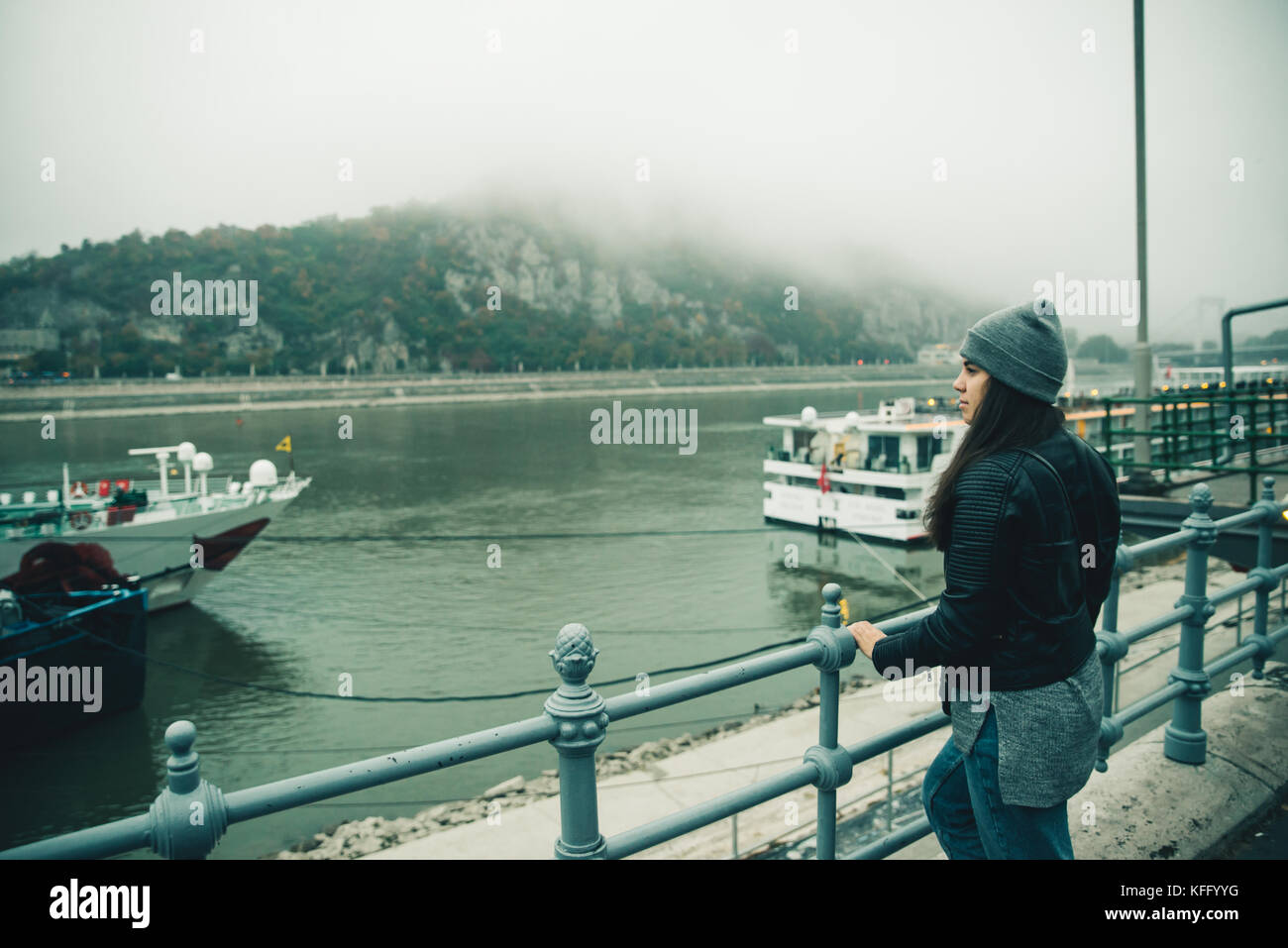 woman at city dock in foggy day in the morning Stock Photo - Alamy