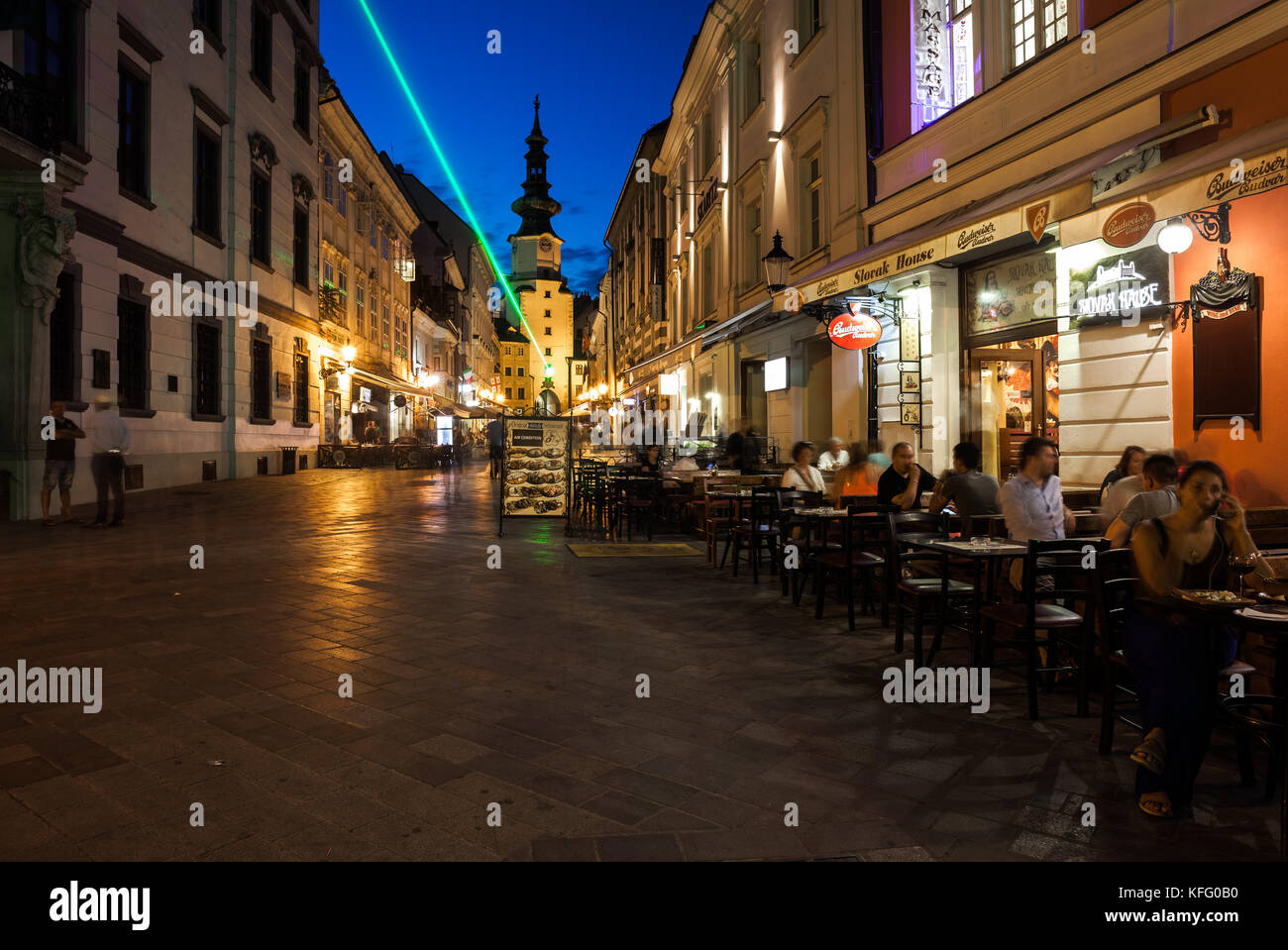 Slovakia, Bratislava, Old Town by night, cafe restaurant Slovak Hause on Michalska Street, city break, view towards Michael's Gate and Tower Stock Photo