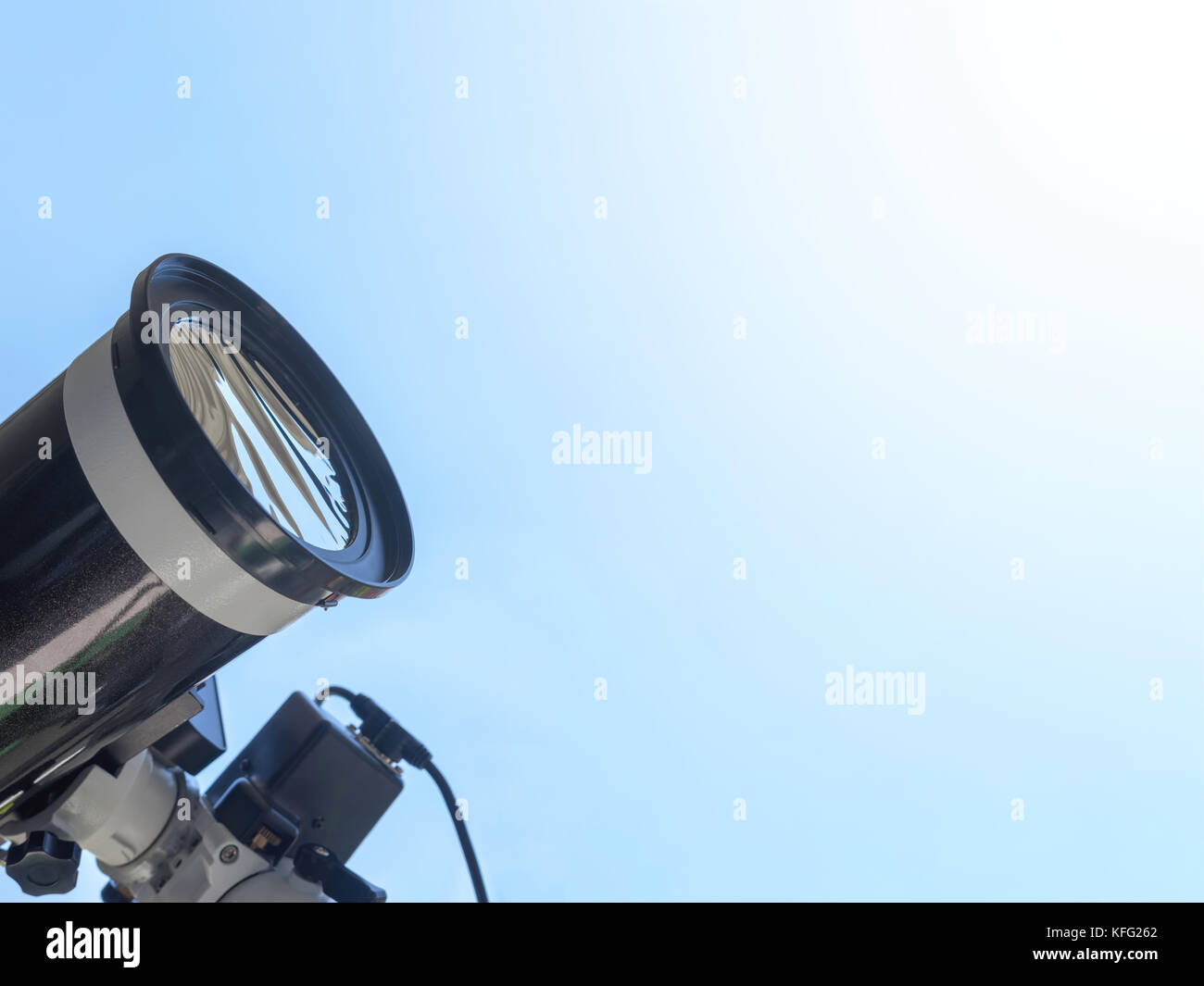 Solar eclipse observing with telescope. Telescope with solar filter