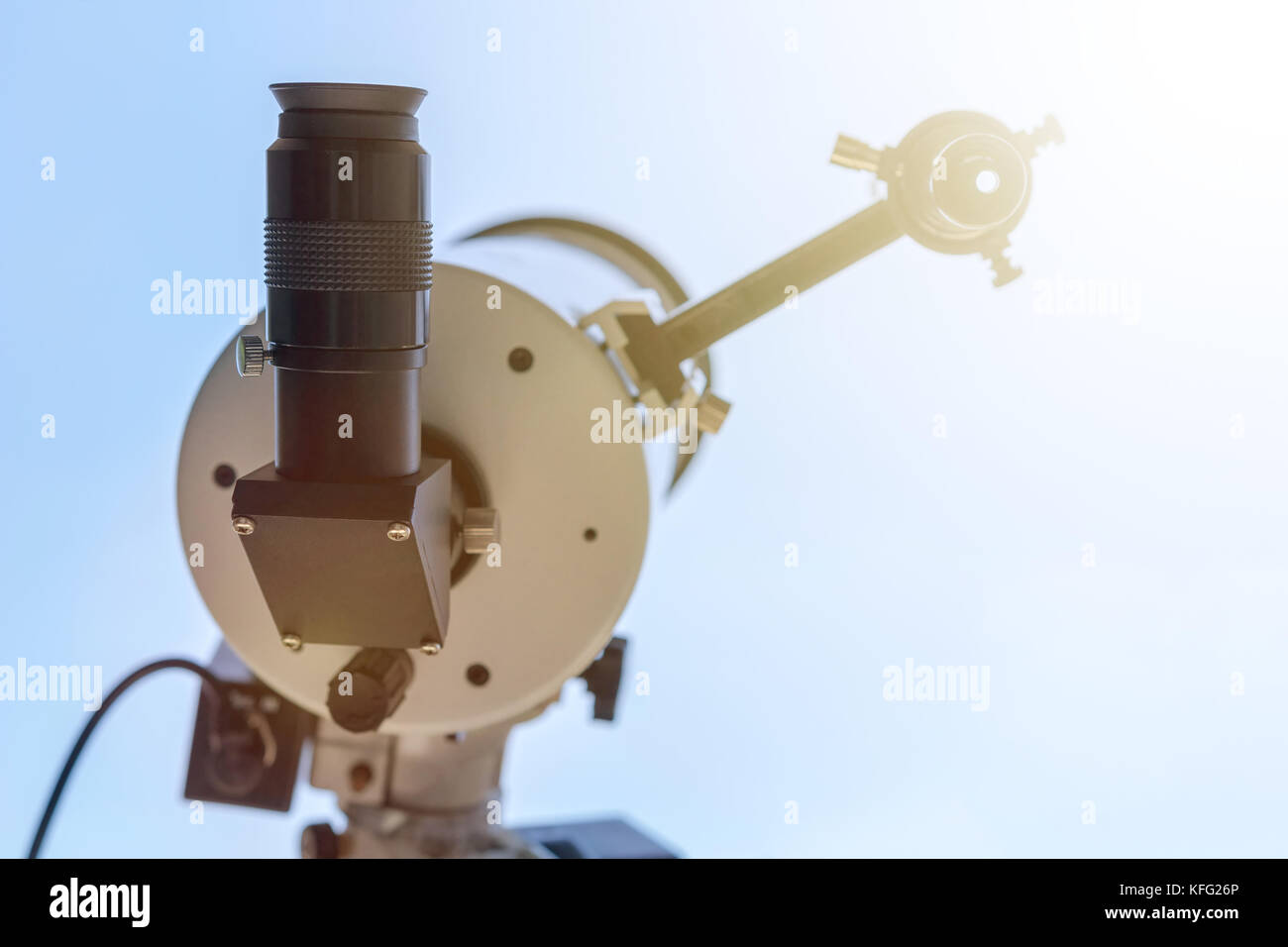 Solar eclipse observing with telescope. Telescope with solar filter