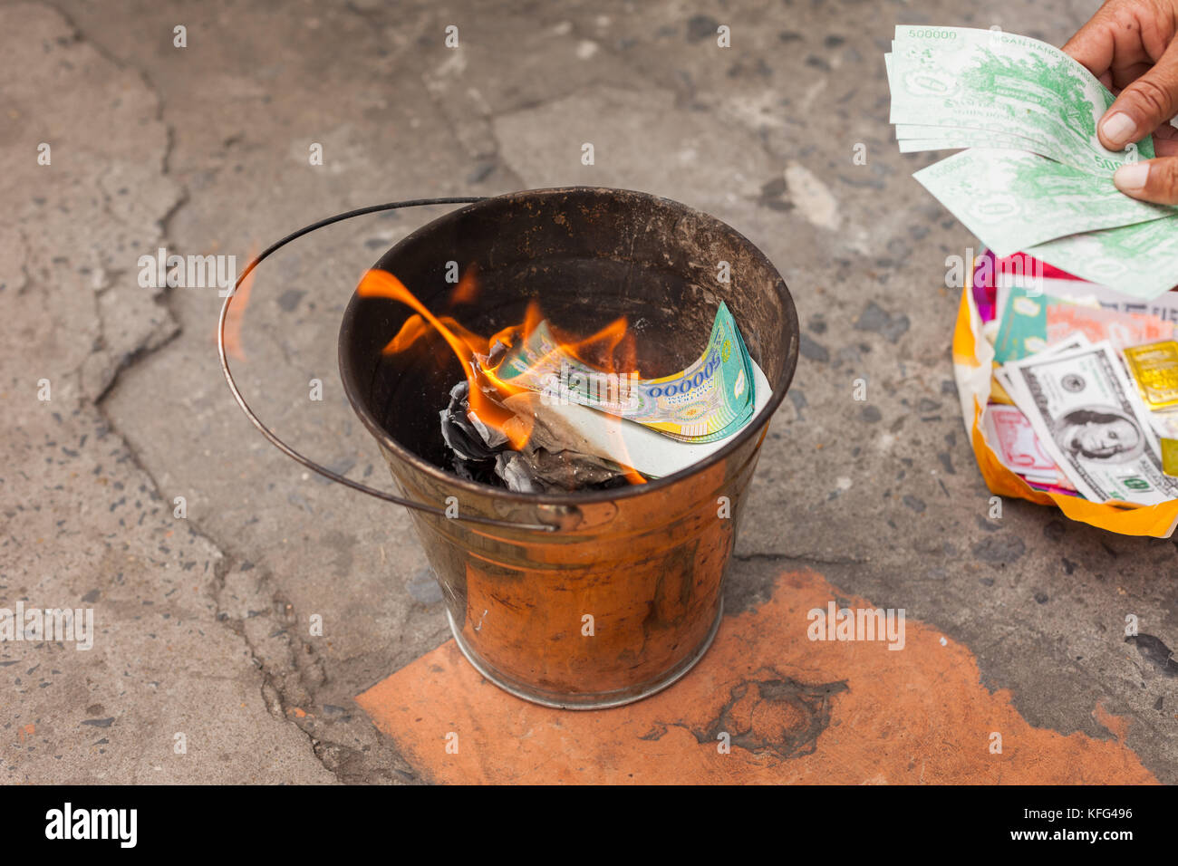 Burning money (Ghost/Votive money, Joss paper) in Vietnam Stock Photo