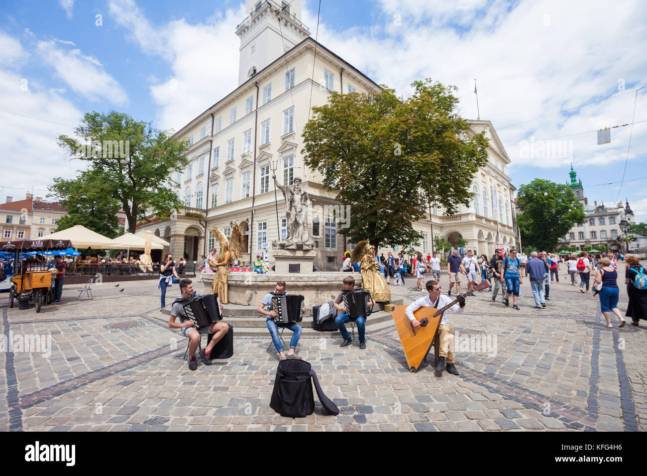 LVIV, UKRAINE - JUNE 3: Street musicians perform Bach on accordions and a balalaika contrabass in Rynok Square, Lviv, Ukraine on 3 June 2017. Stock Photo